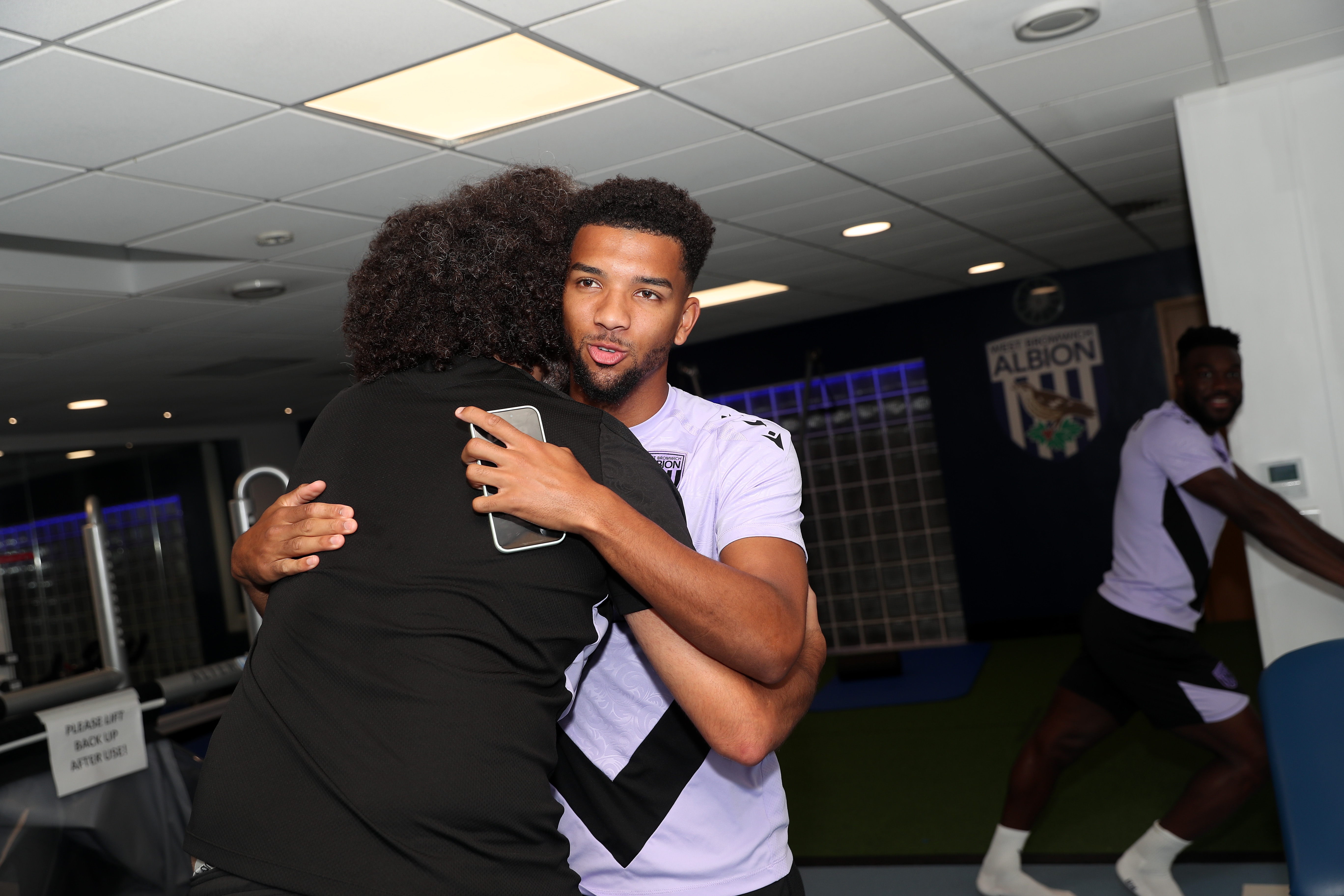 Mason Holgate hugging a member of staff