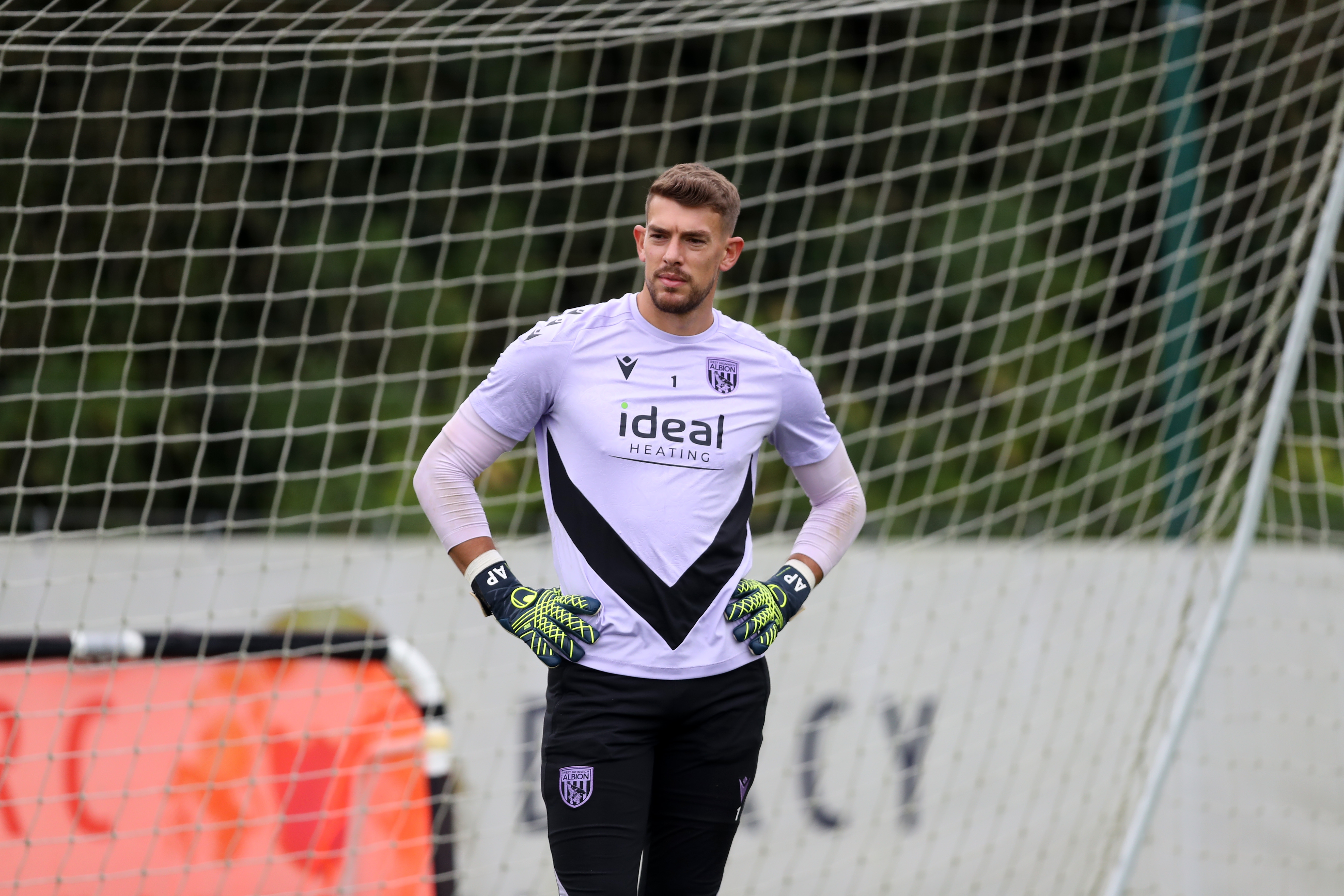 Alex Palmer with his hands on his hips during a training session 