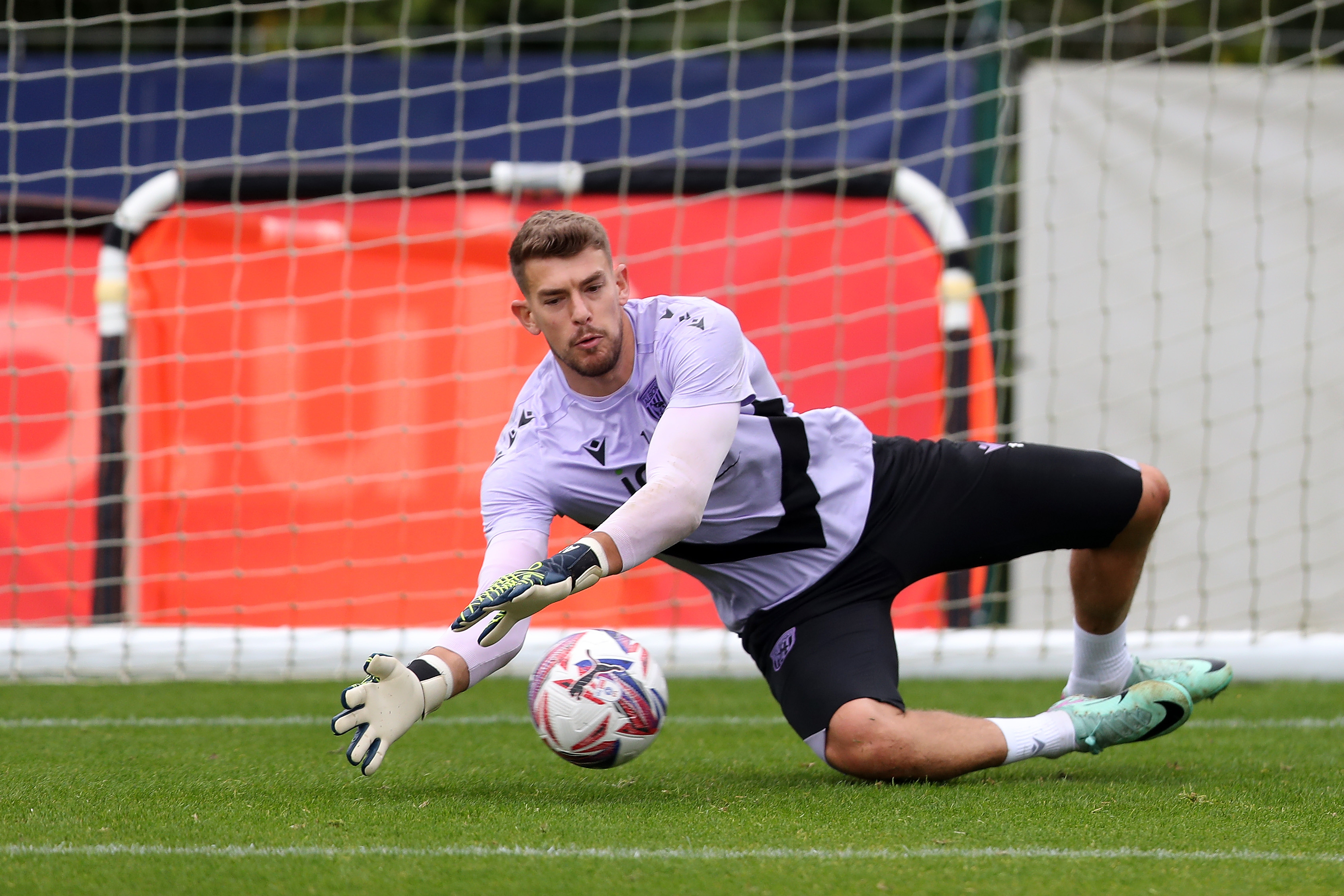 Alex Palmer making a save during a training session