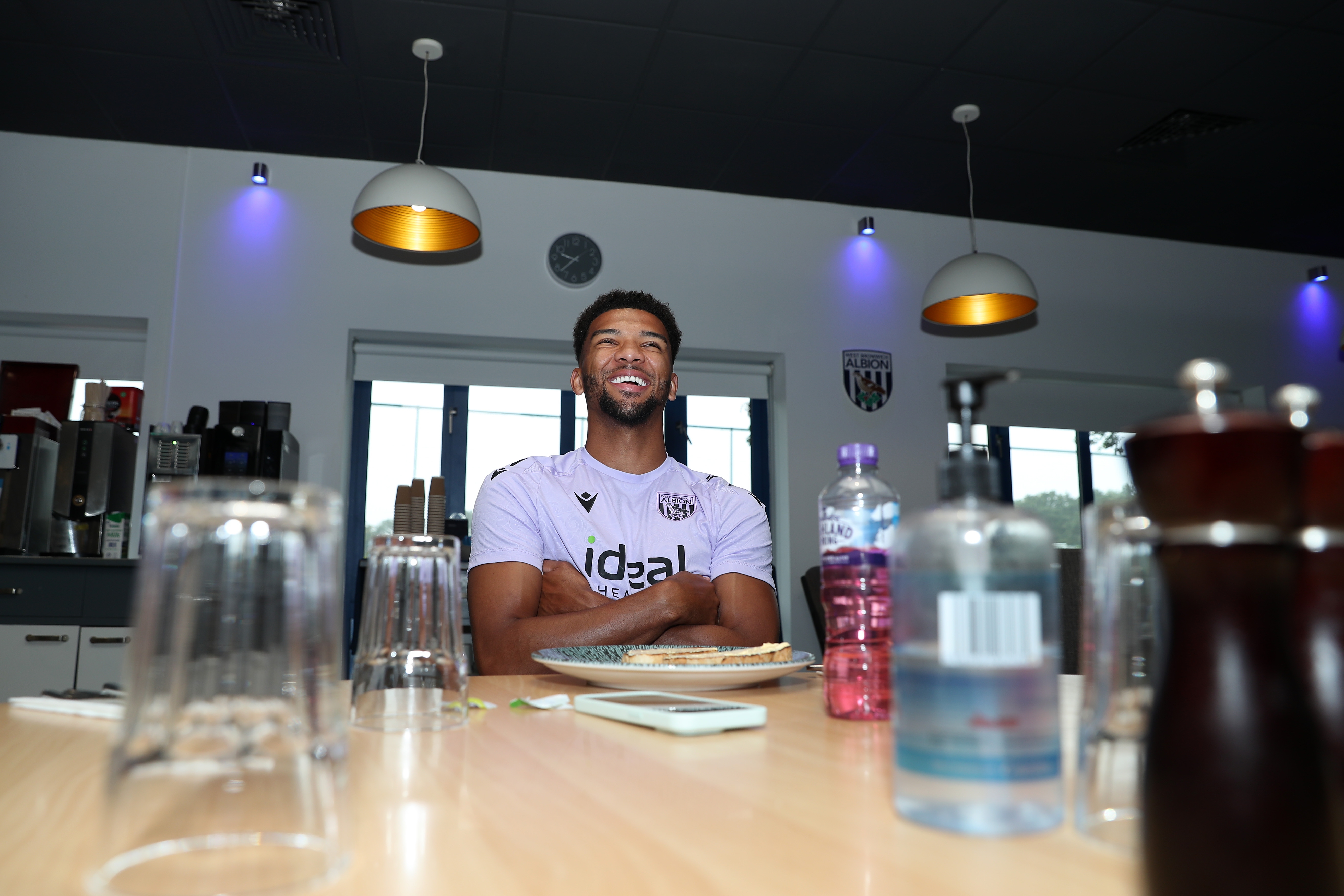 Mason Holgate smiling sat at the table in the canteen