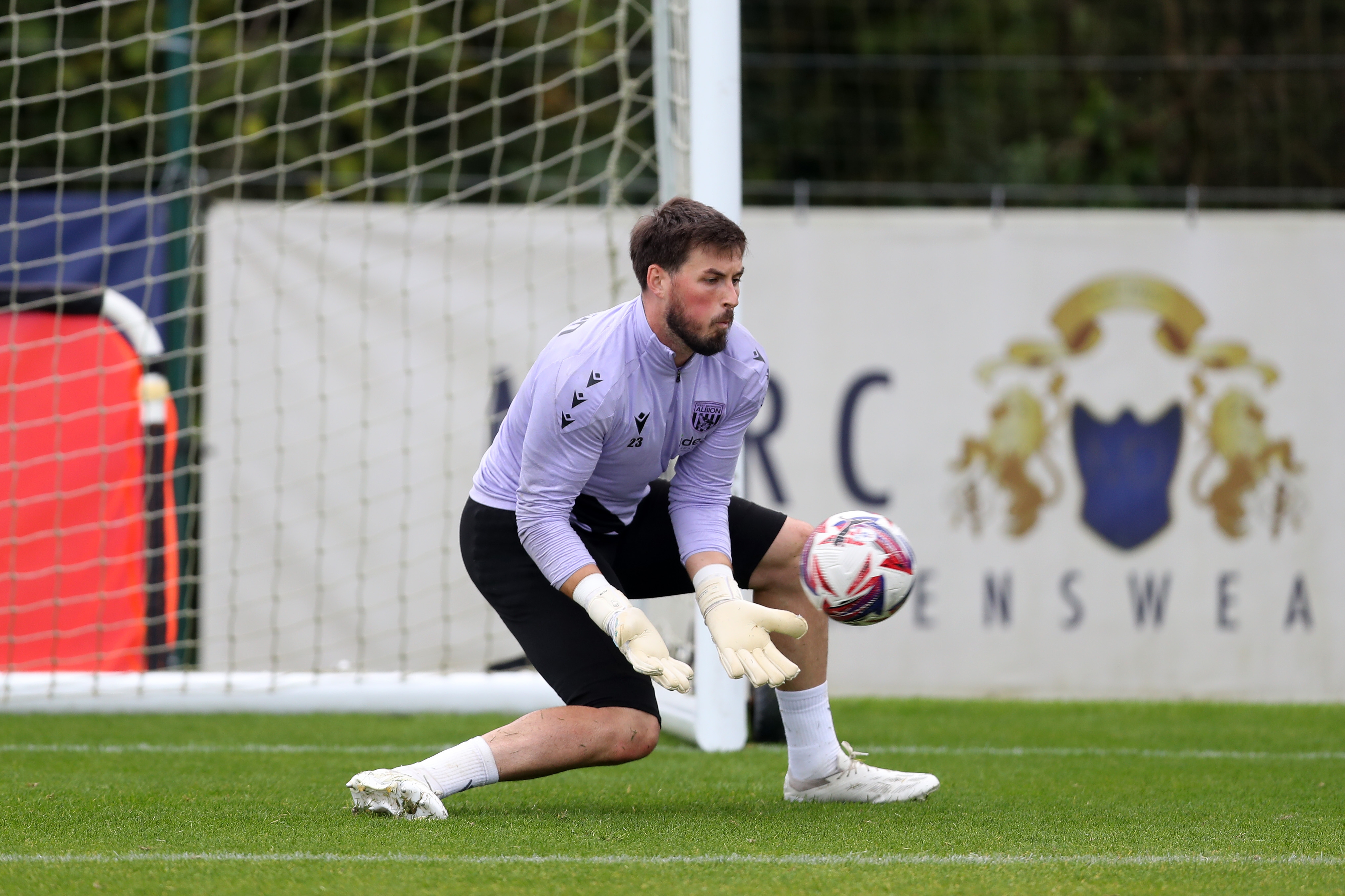 Joe Wildsmith making a save during a training session