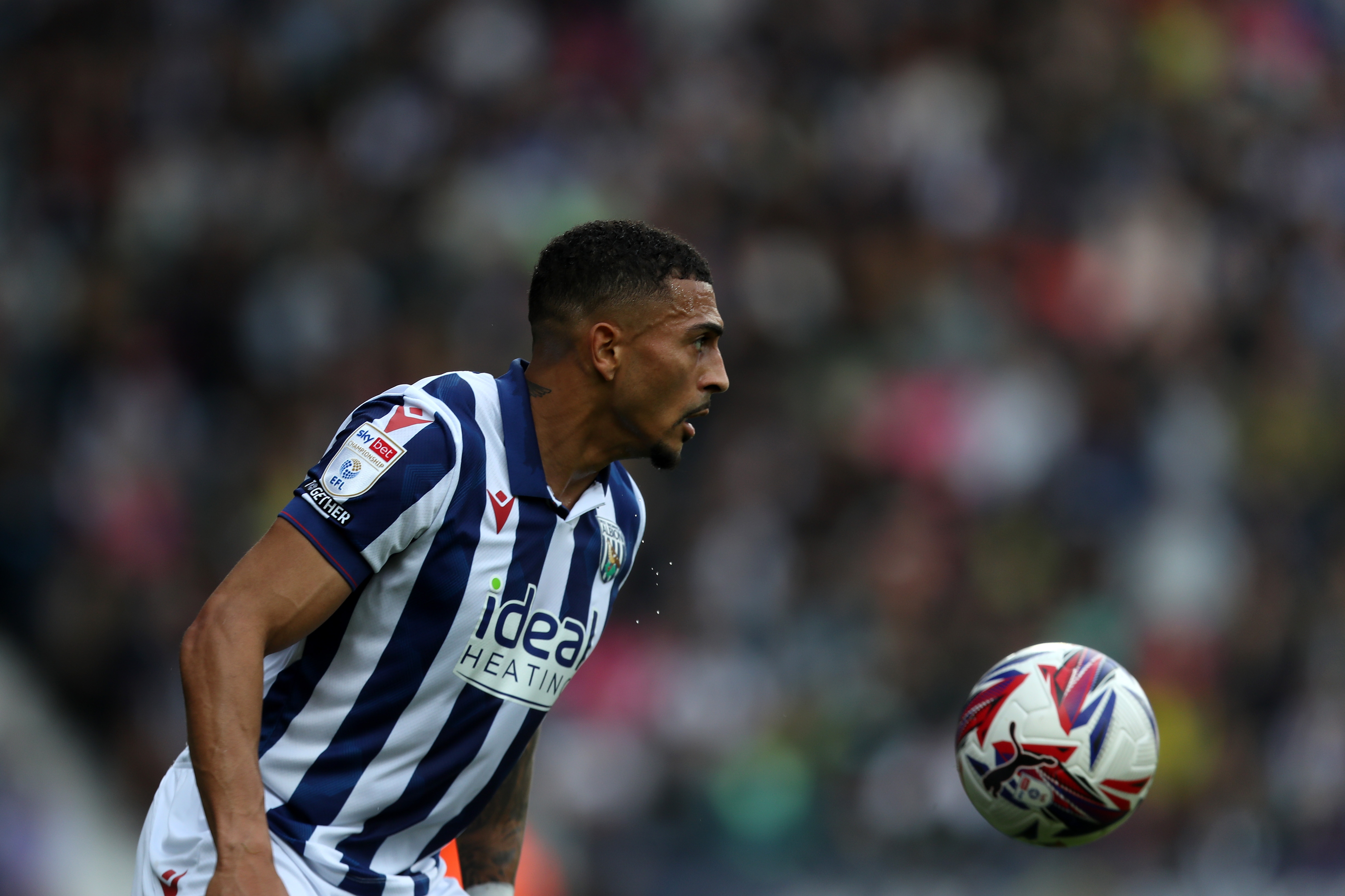 Karlan Grant looking at the ball against Plymouth 