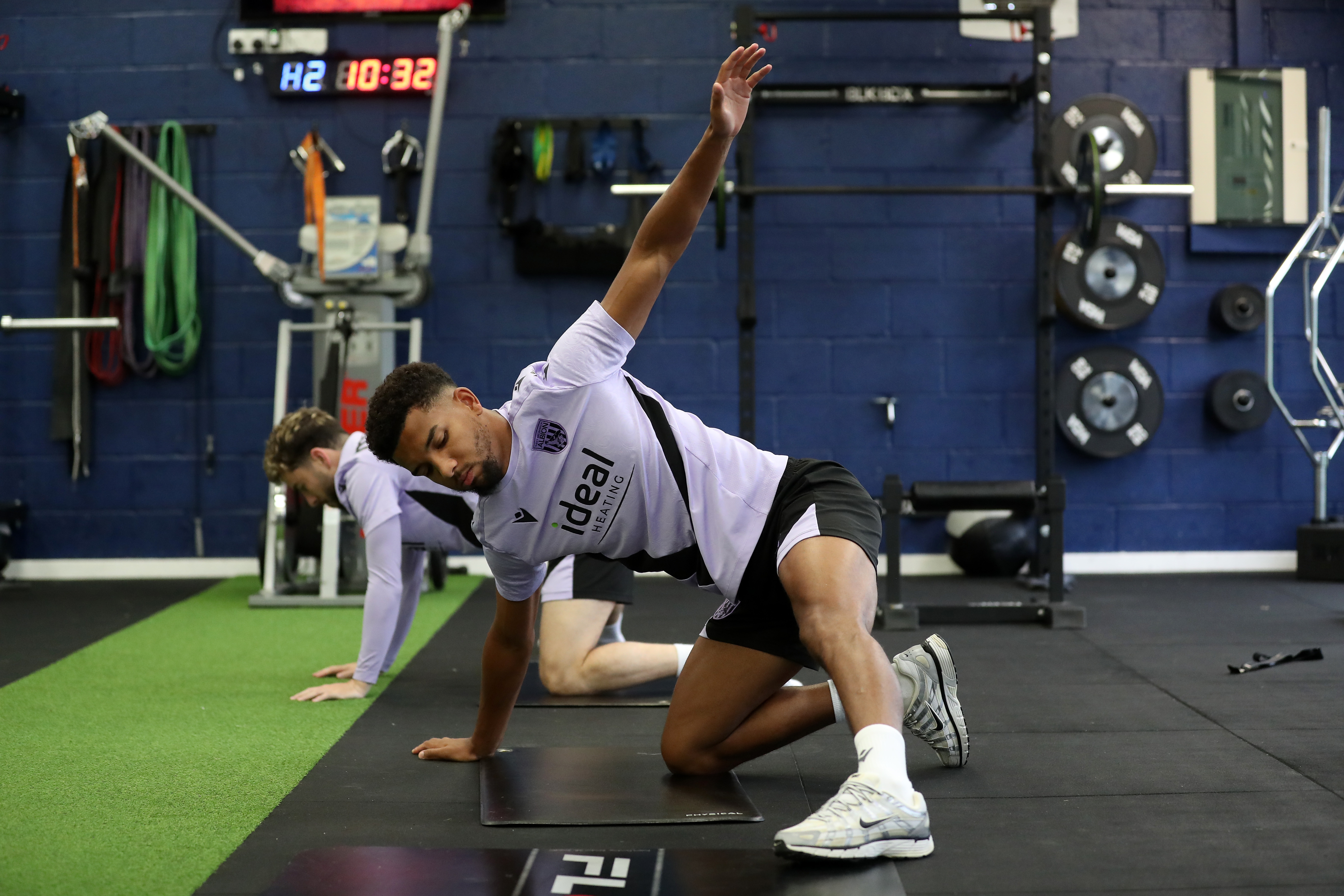 Mason Holgate stretching in the gym