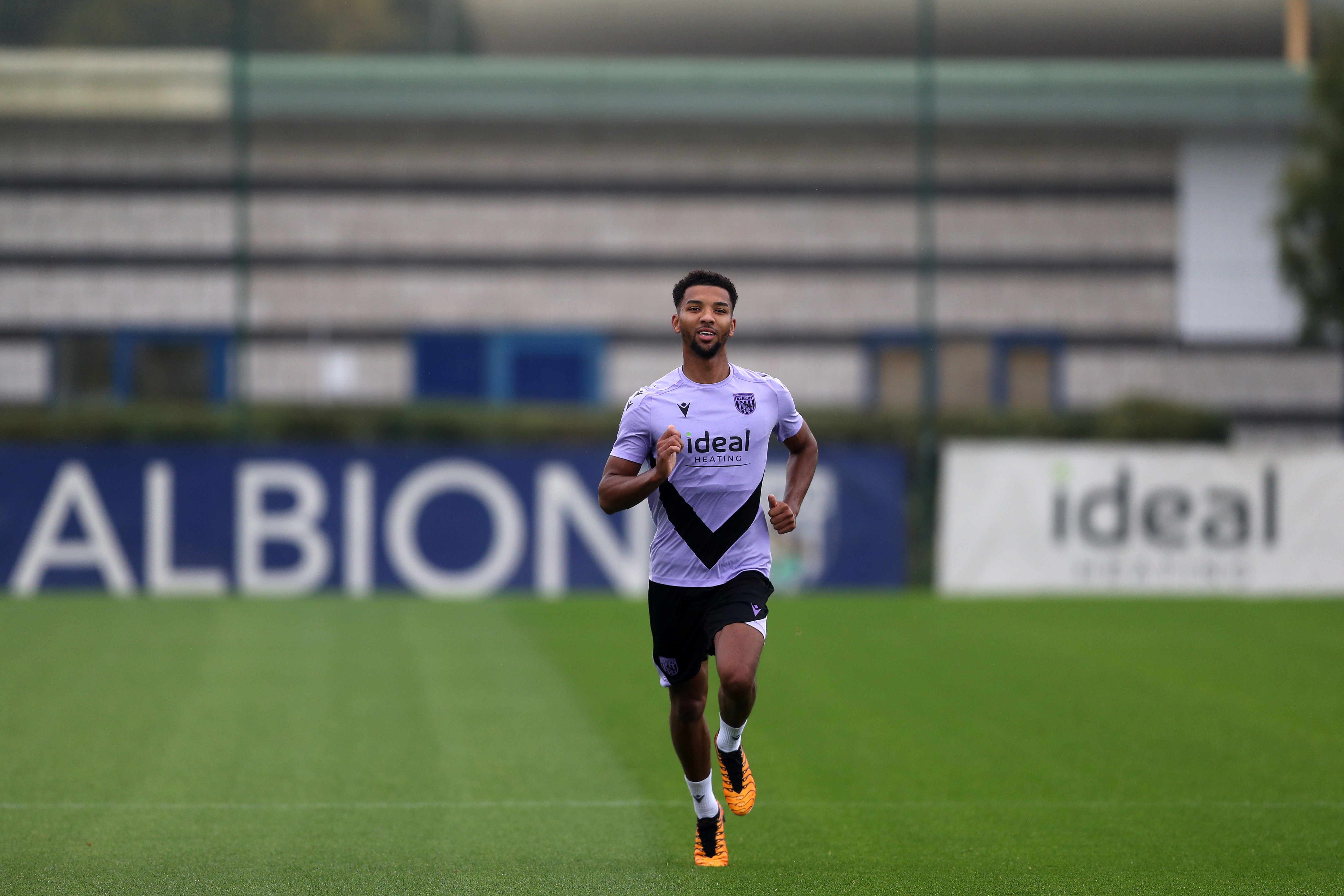 Mason Holgate running forward on the training pitch 