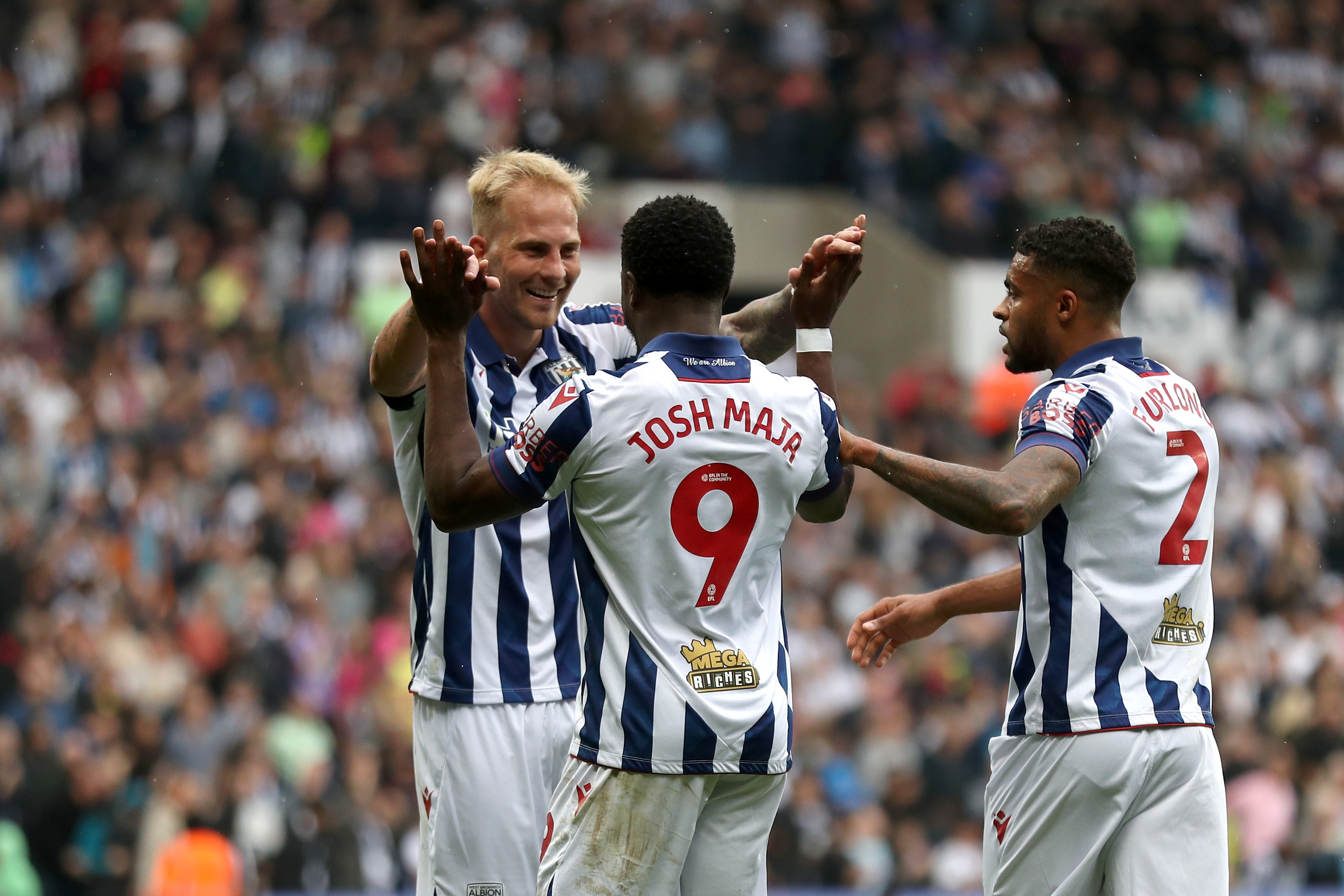 Josh Maja celebrates scoring against Plymouth with team-mates at The Hawthorns