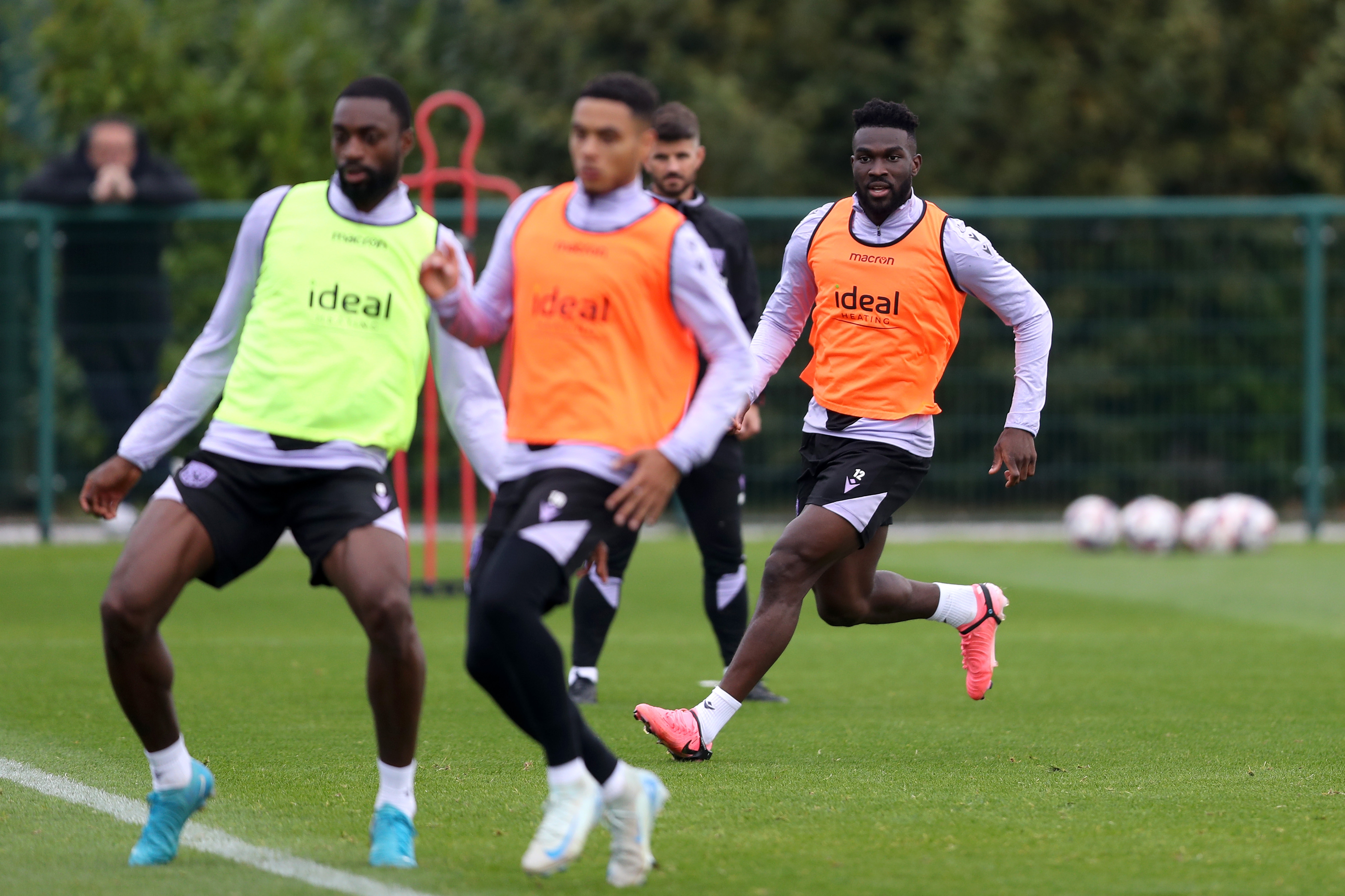 Several players watching the ball during a training session 