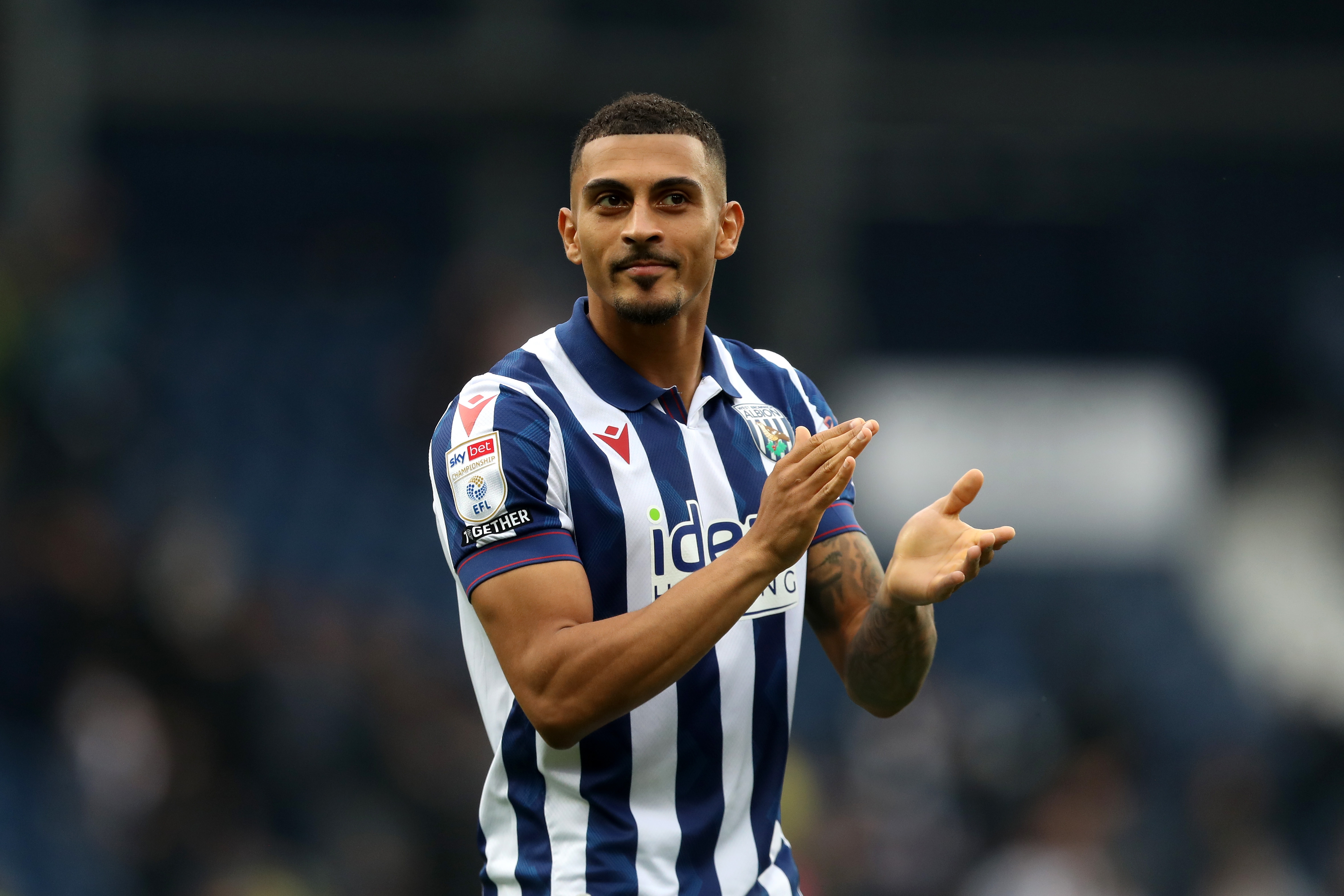 Karlan Grant applauding Albion fans at The Hawthorns