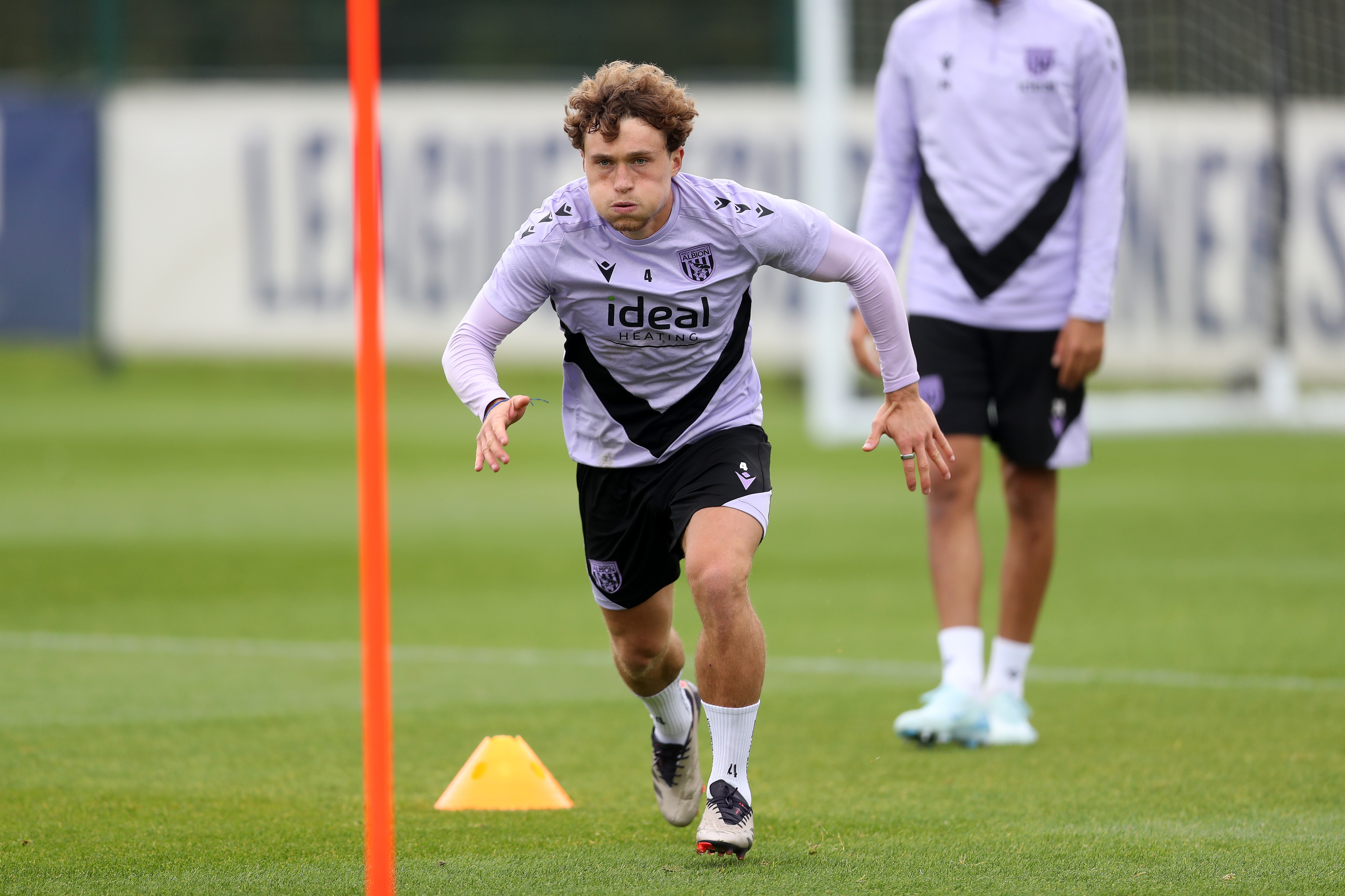 Callum Styles running forwards during a training session 