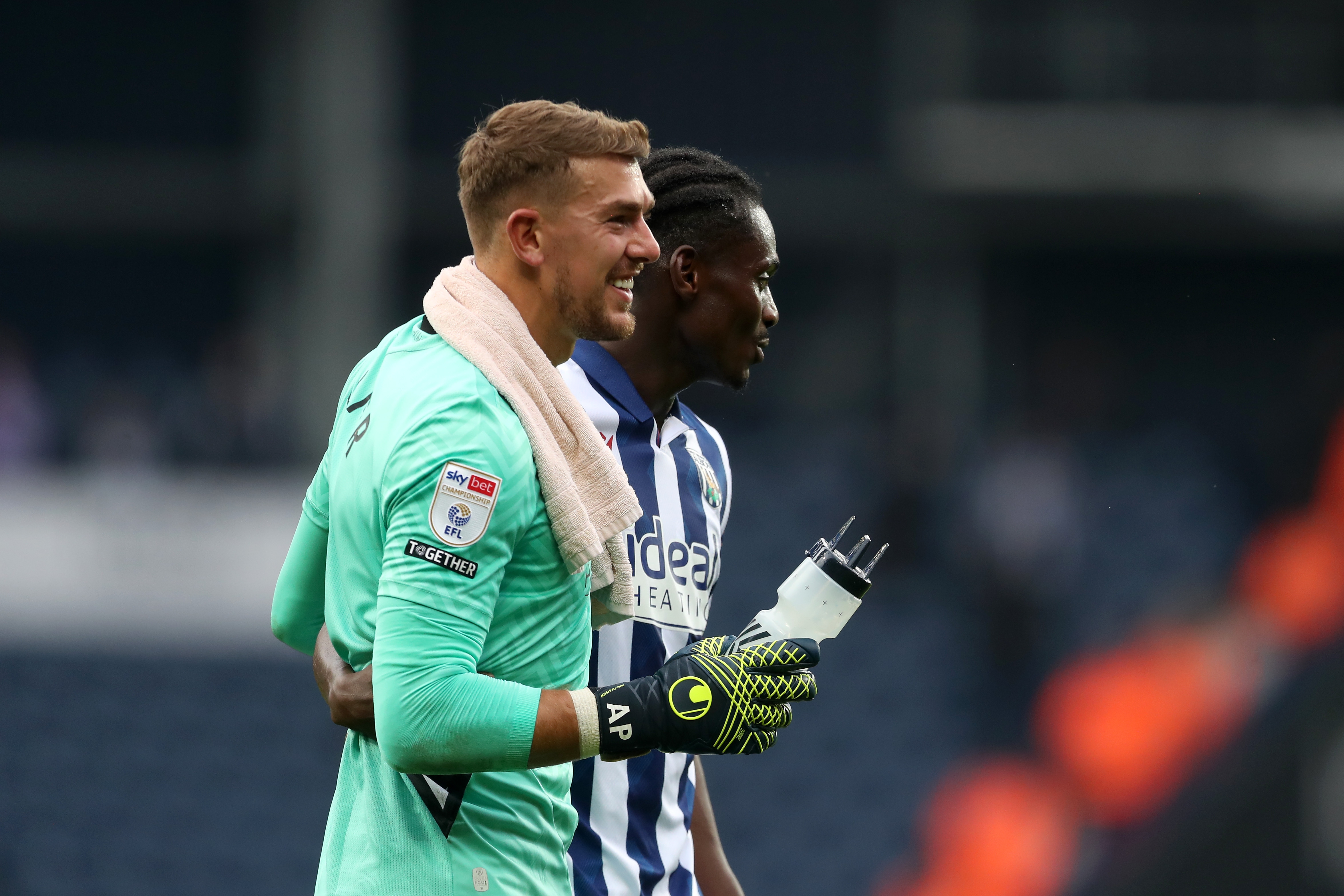 Alex Palmer and Ousmane Diakité embrace at full-time against Plymouth 