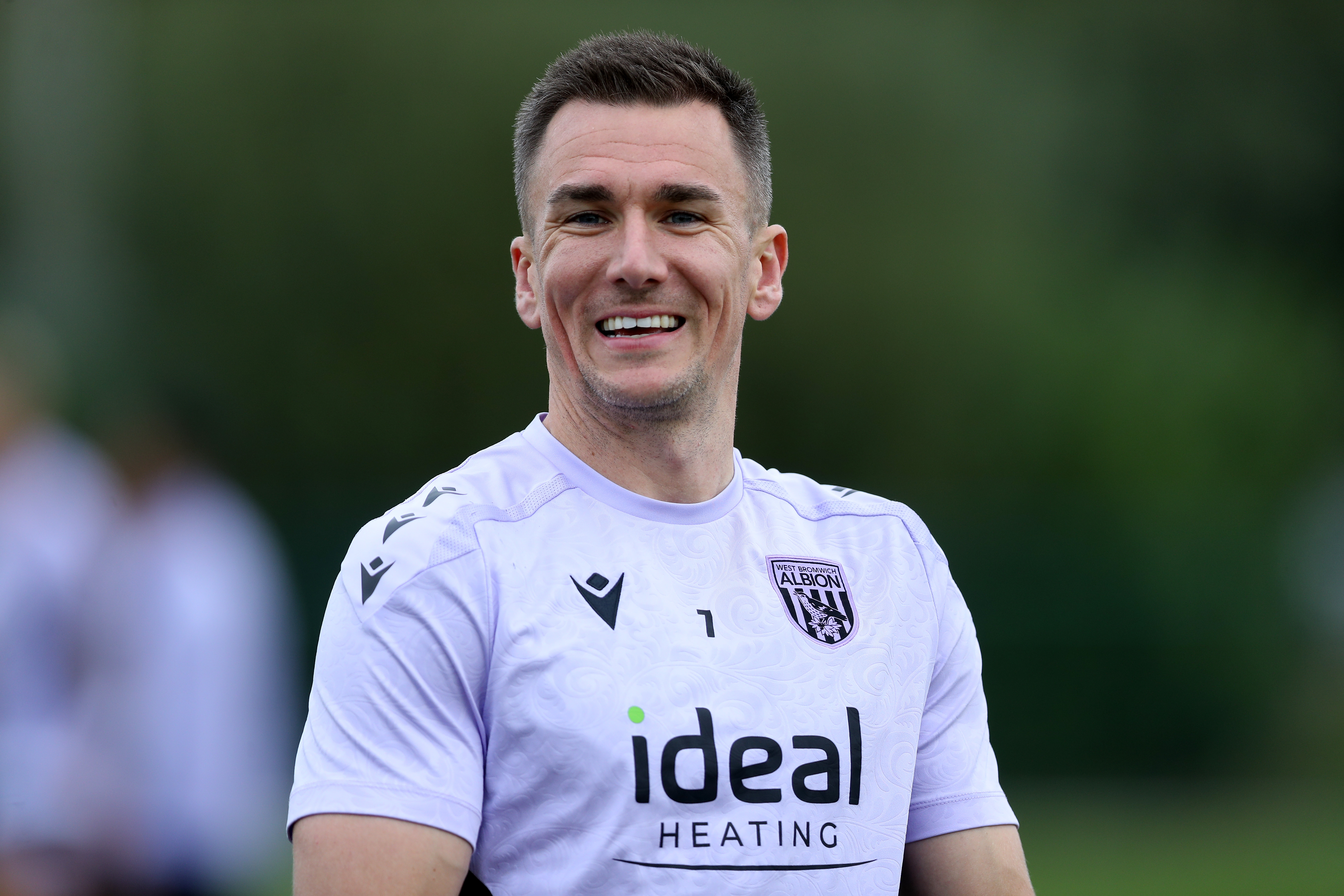 Jed Wallace smiling during a training session 