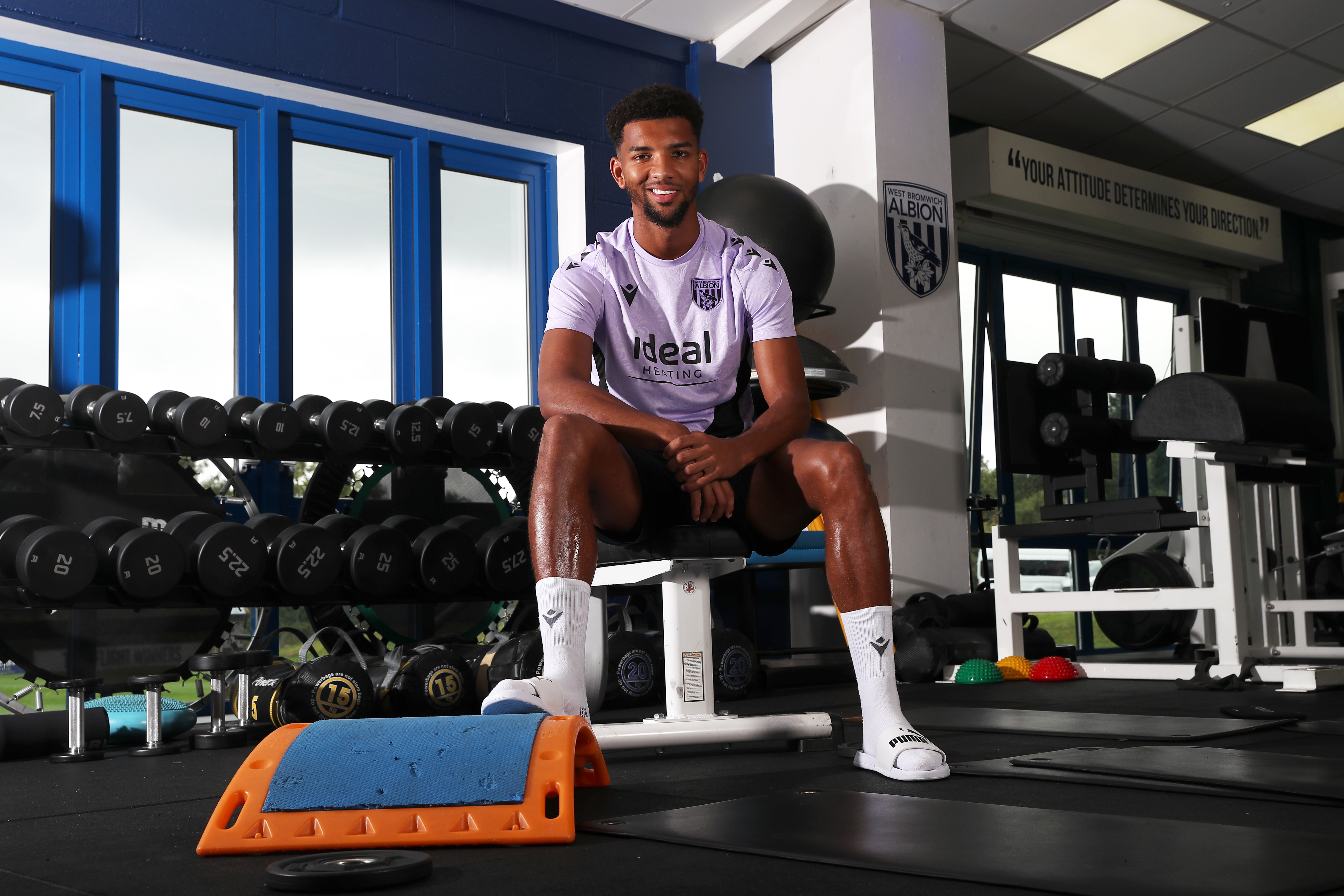 Mason Holgate smiling at the camera while sat in the gym