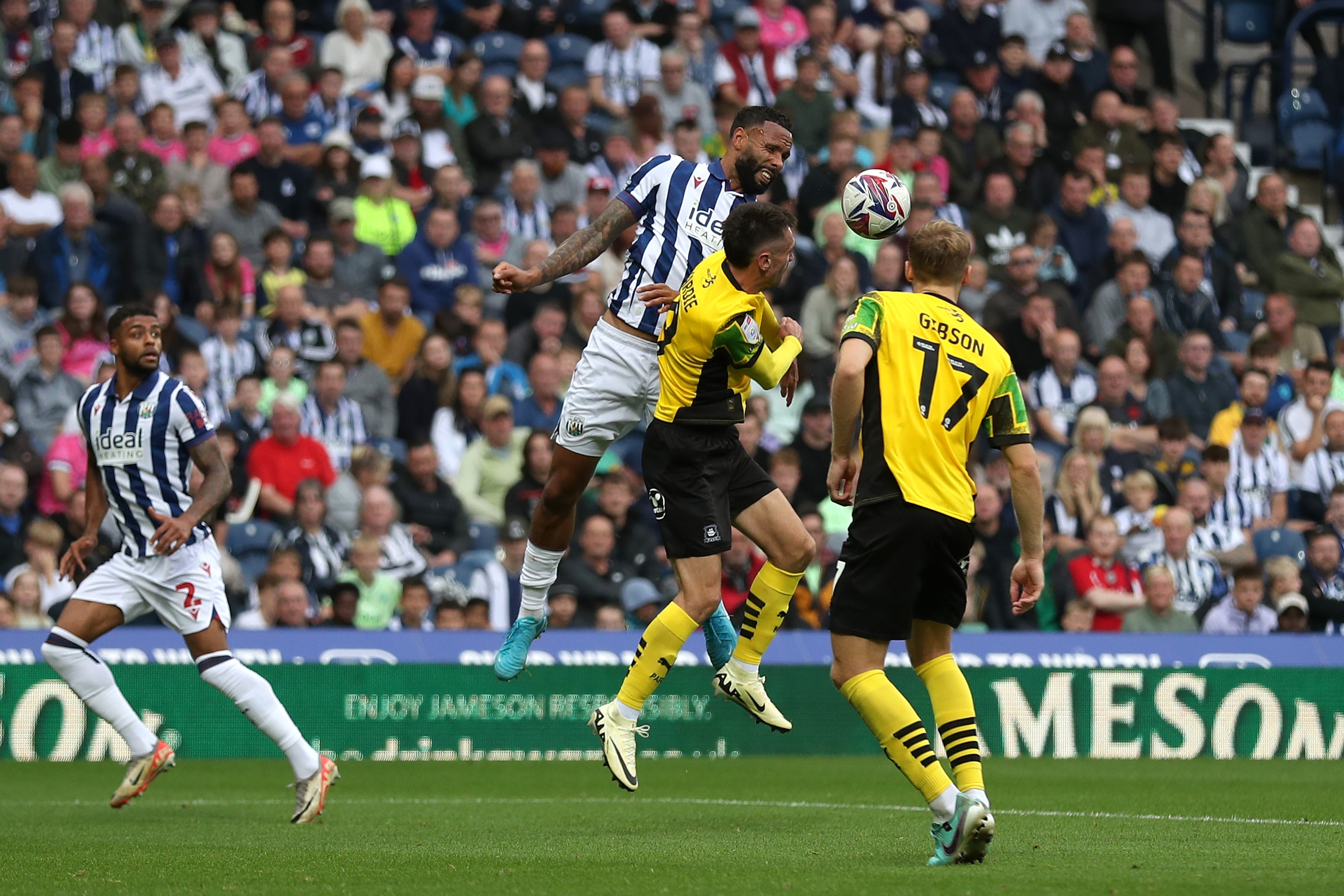 Kyle Bartley jumping to try and win the ball against Plymouth 