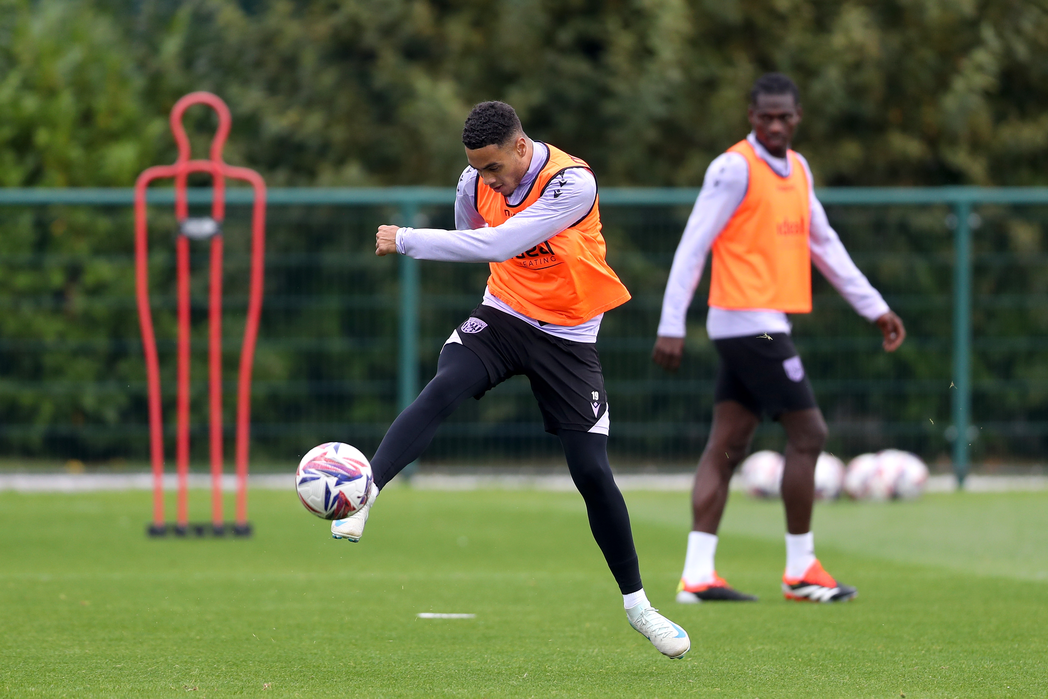 Lewis Dobbin firing at goal during a training session 