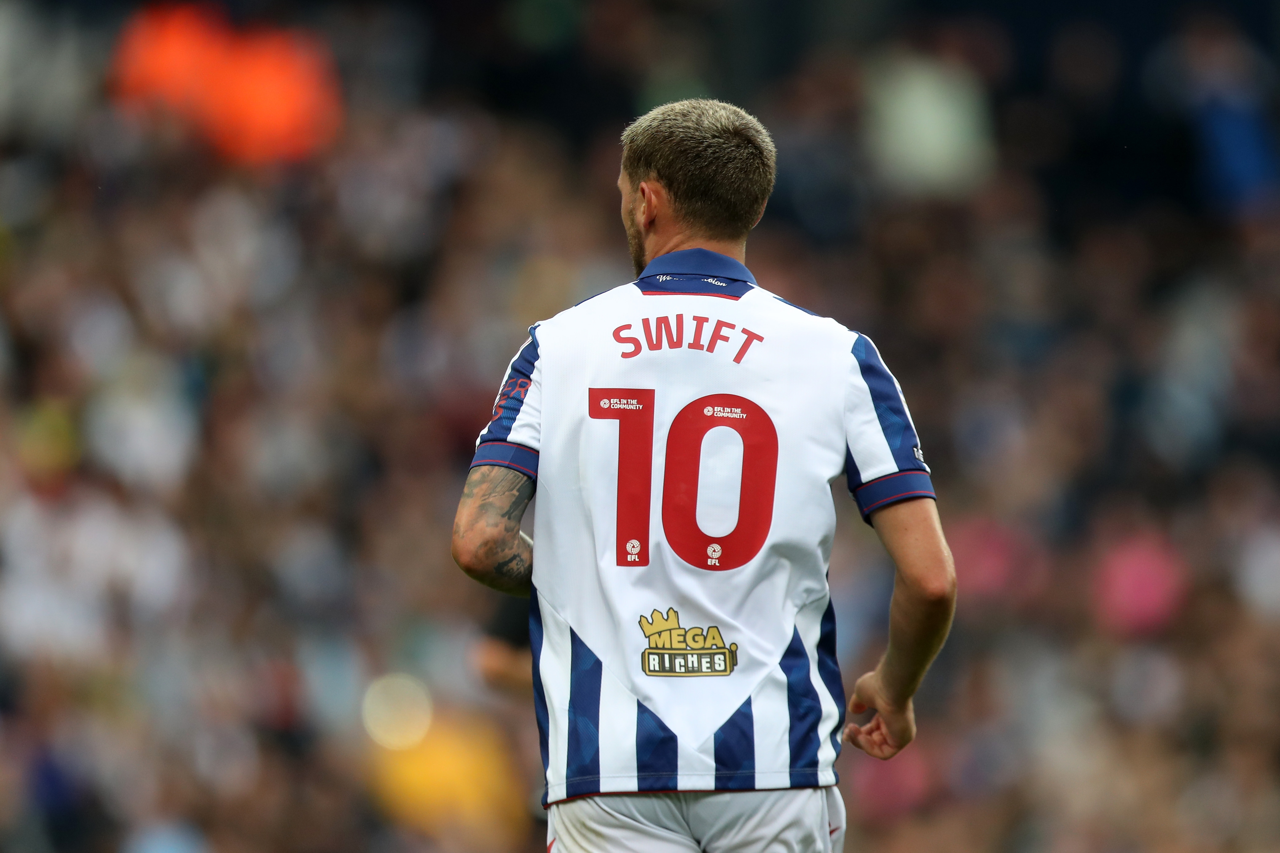 The back of John Swift's shirt with his name and No.10 on show