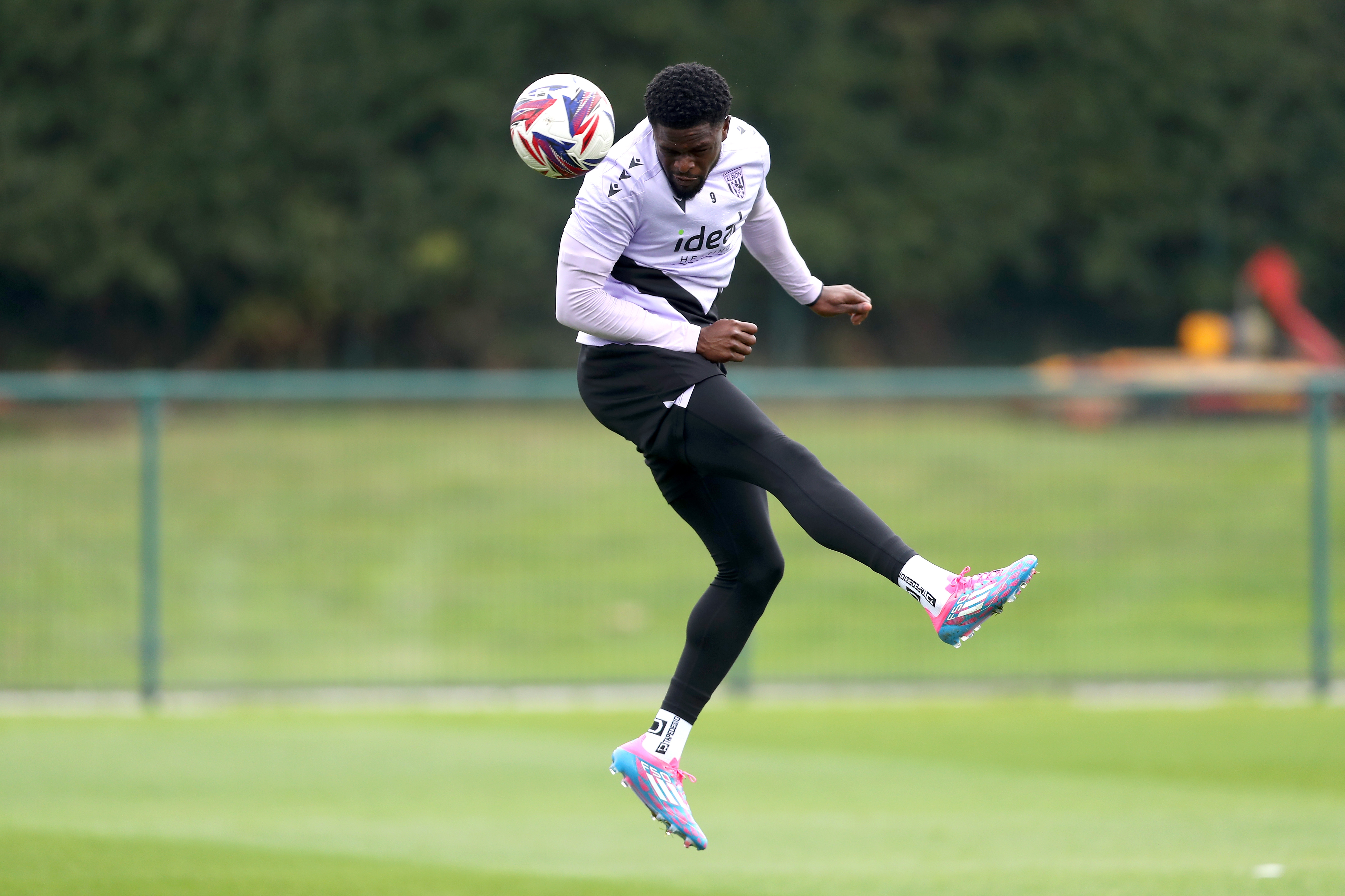 Josh Maja heading the ball during training 