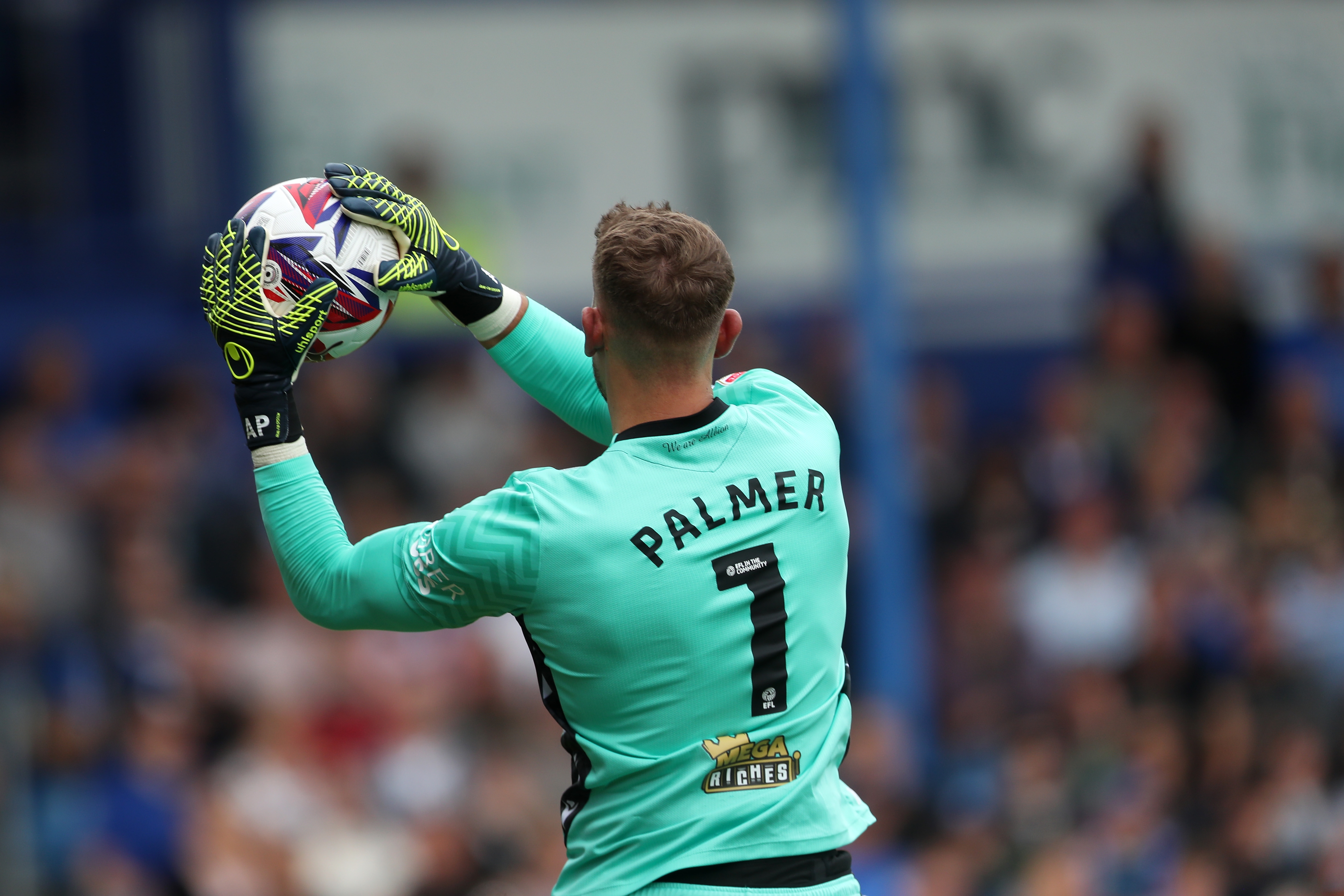 Albion in action against Portsmouth at Fratton Park, in yellow and blue away colours.