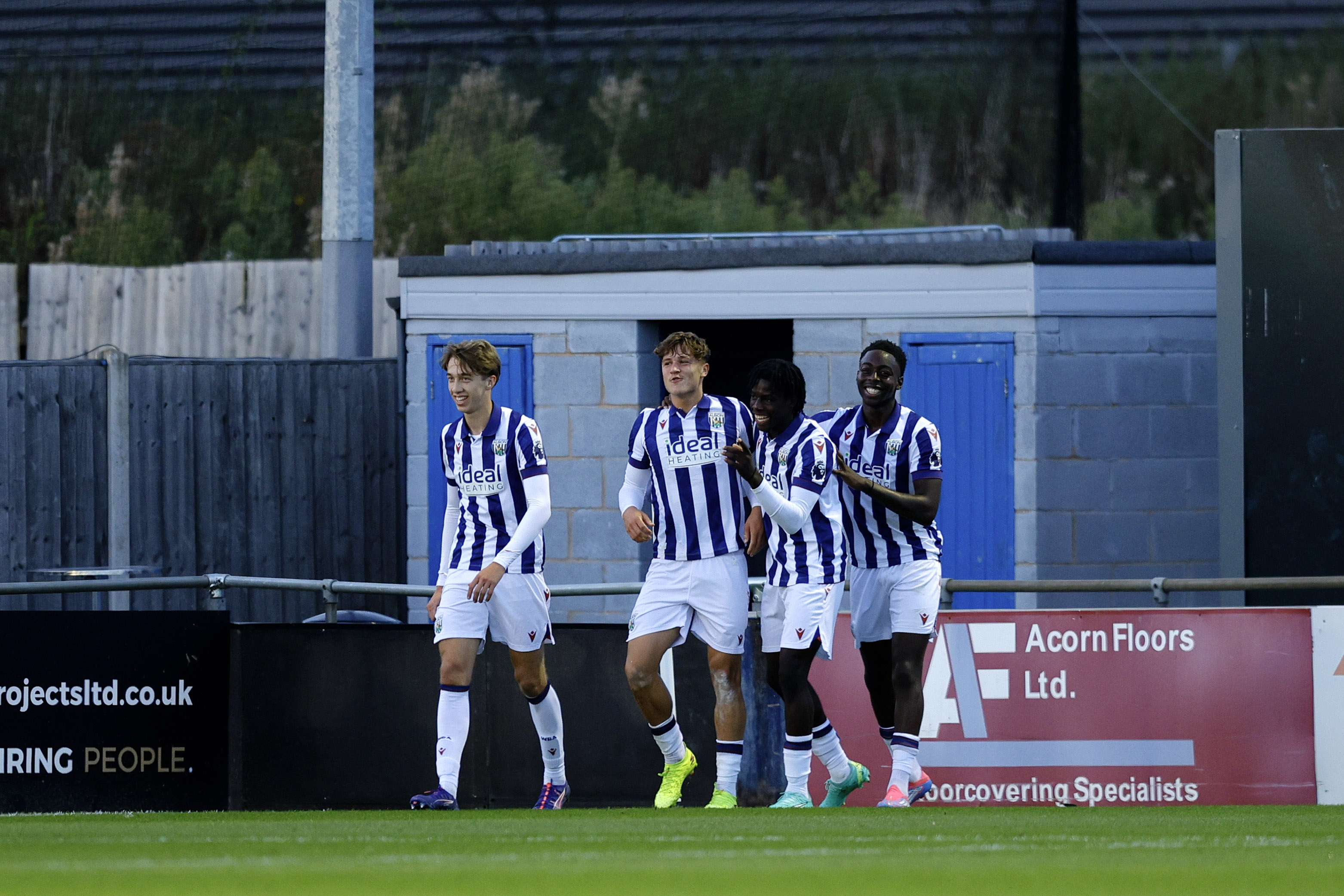 Cole Deeming celebrates scoring, in home colours.