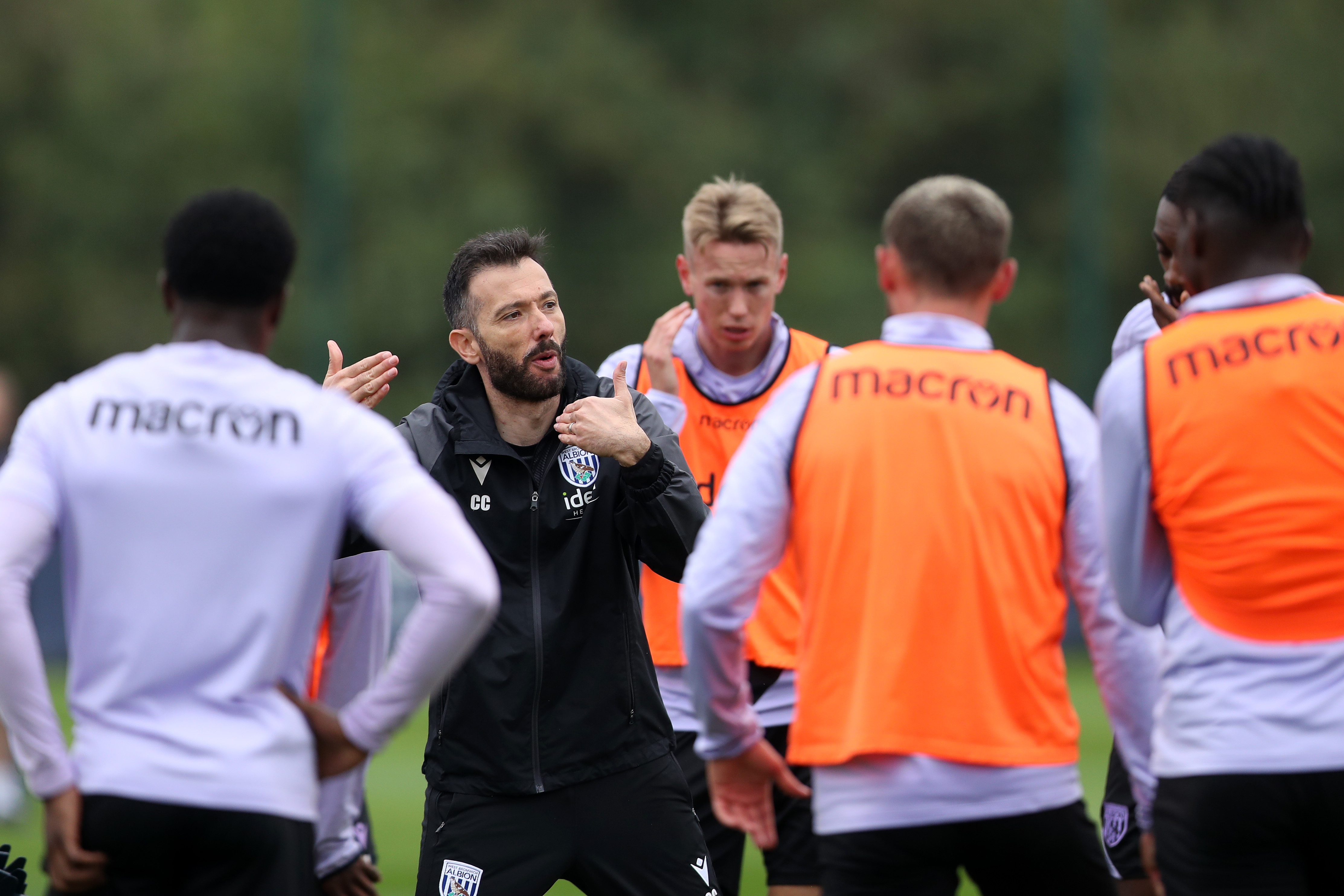 Carlos Corberan delivers info to his squad during training