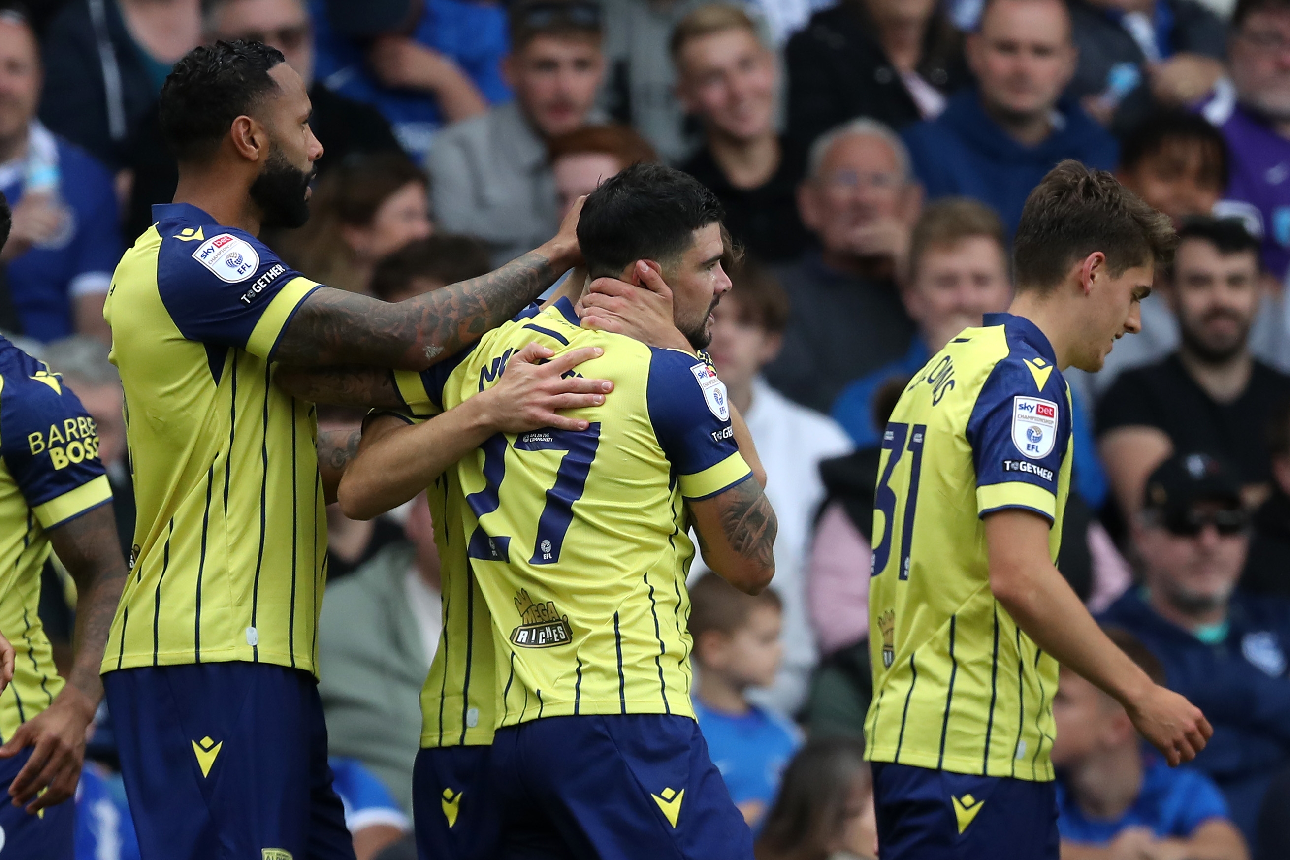 Alex Mowatt celebrates with team-mates following his goal at Portsmouth 