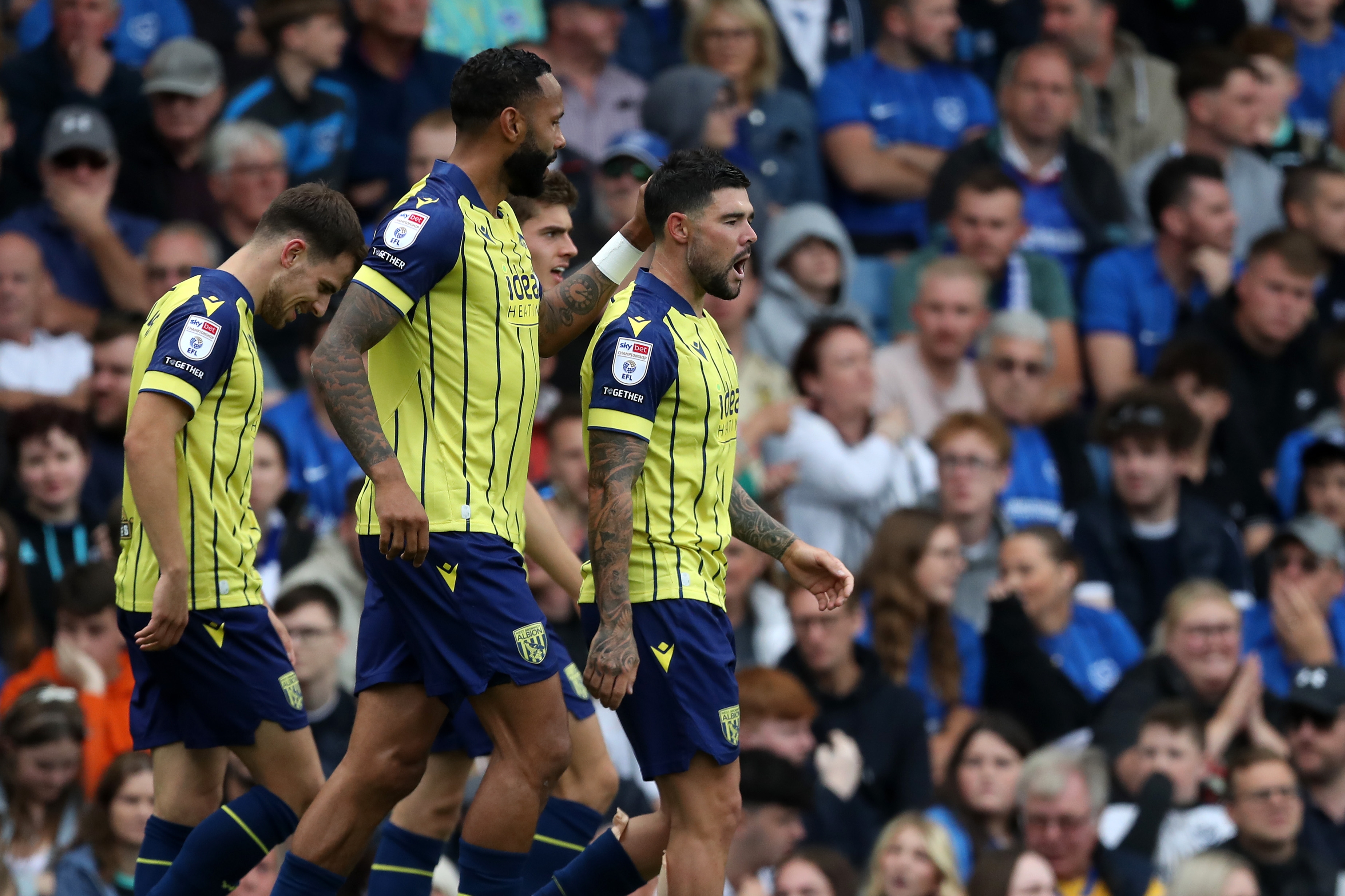 Alex Mowatt celebrates with team-mates following his goal at Portsmouth 