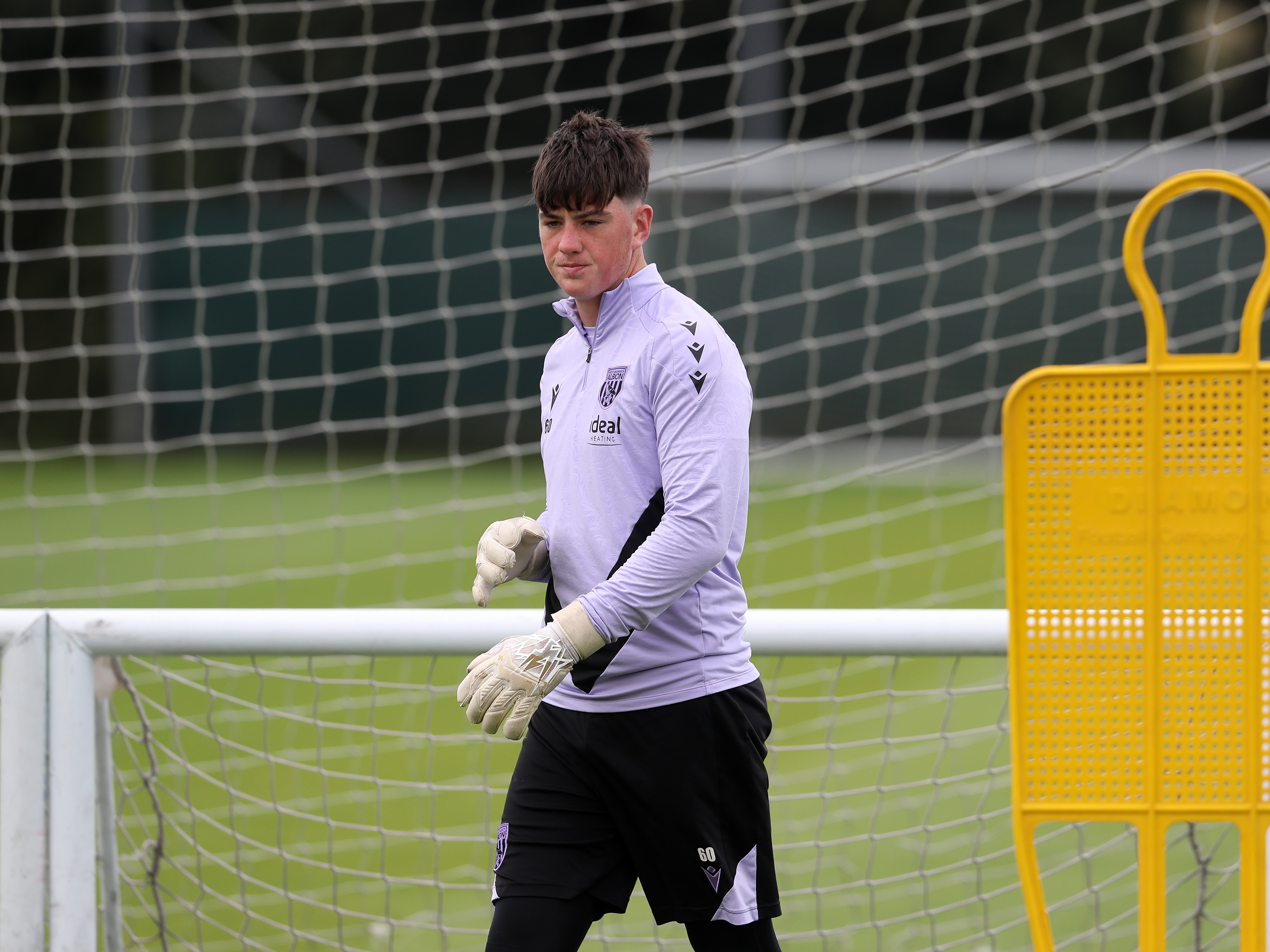 A photo of Albion U18s goalkeeper Louis Brady in the 2024/25 purple training wear