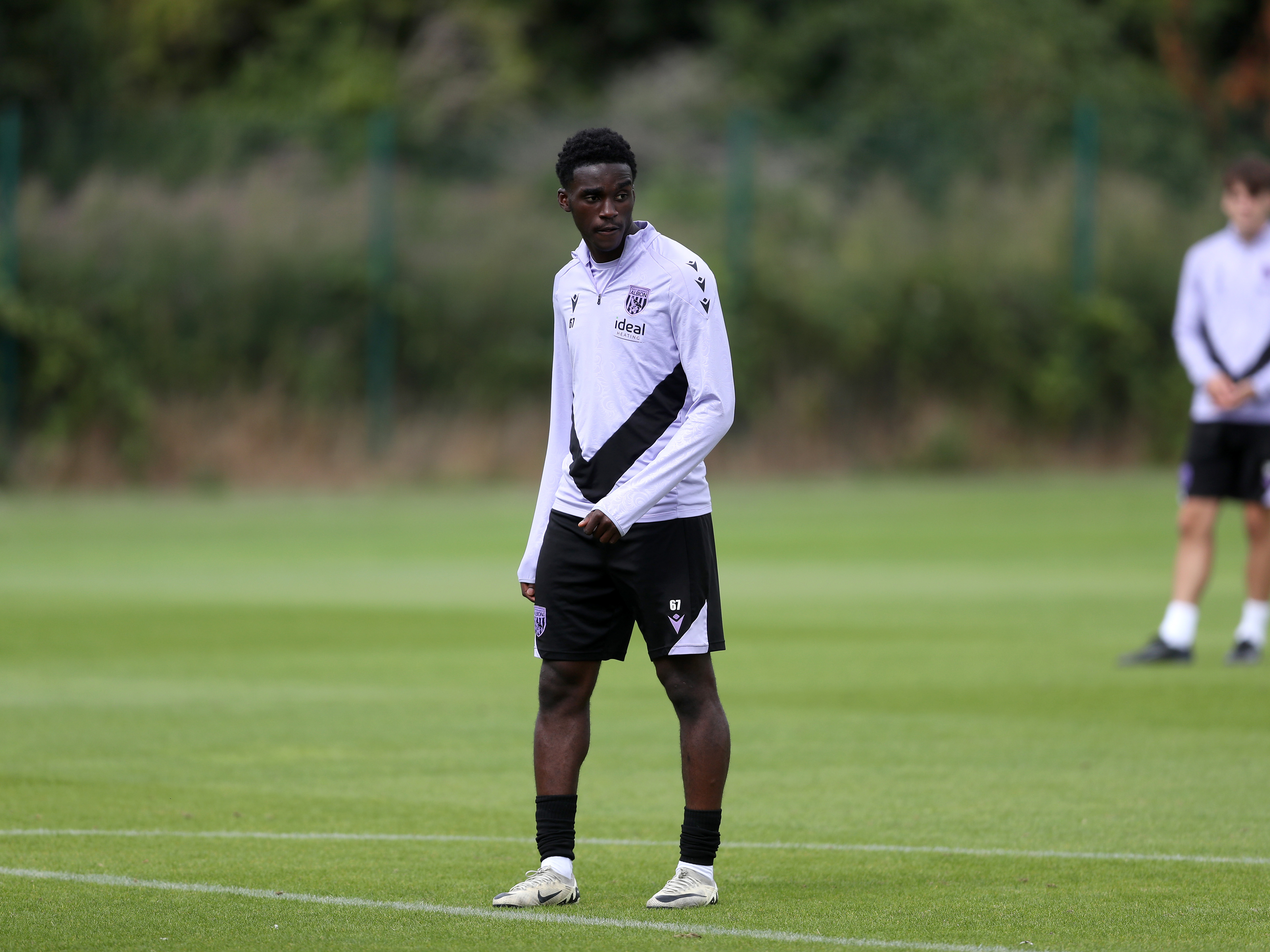 A photo of Albion U18s striker Dan Chimeziri in the 2024/25 purple training kit