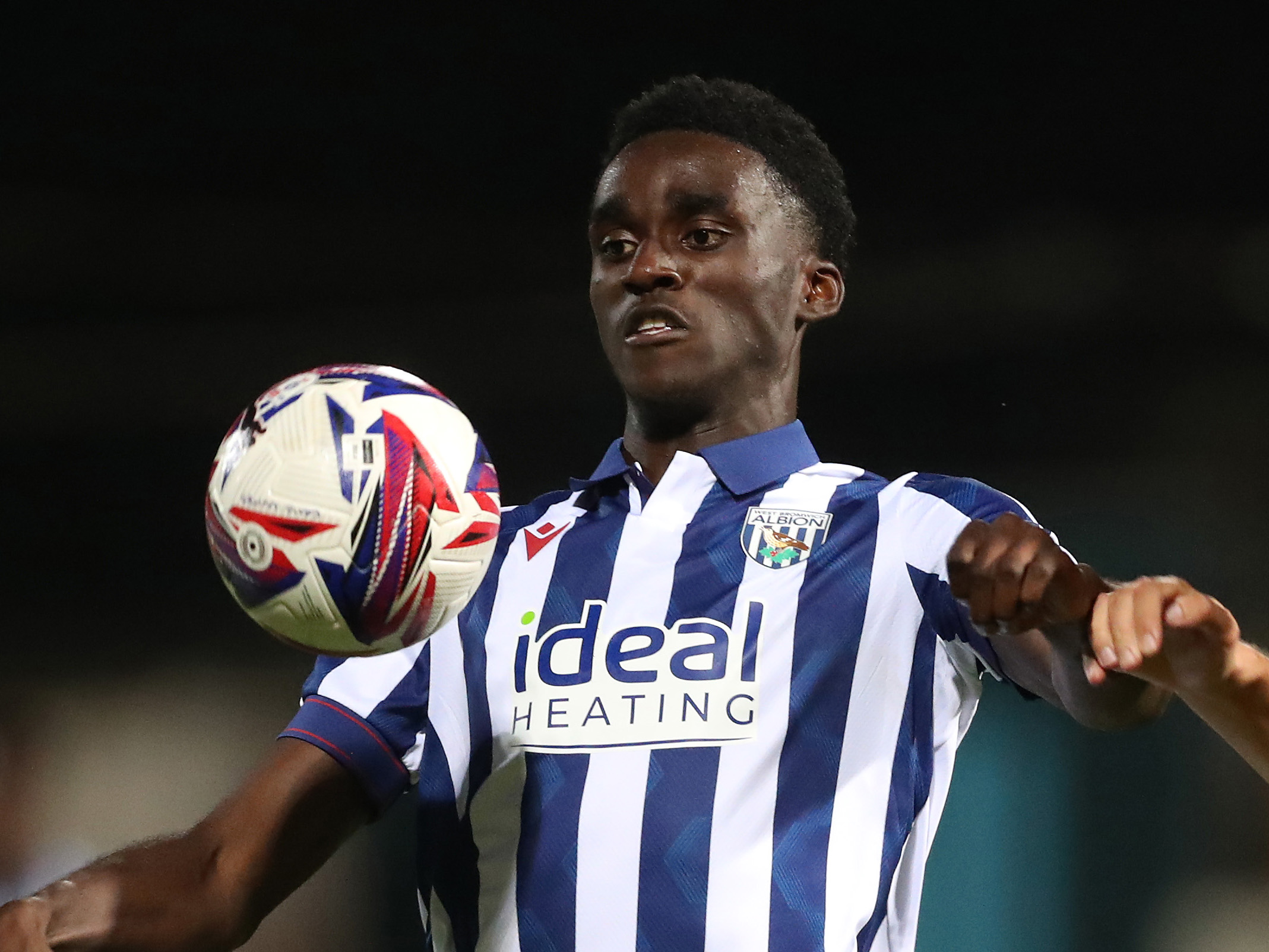 A photo of Albion U18s striker Dan Chimeziri in the 2024/25 home kit