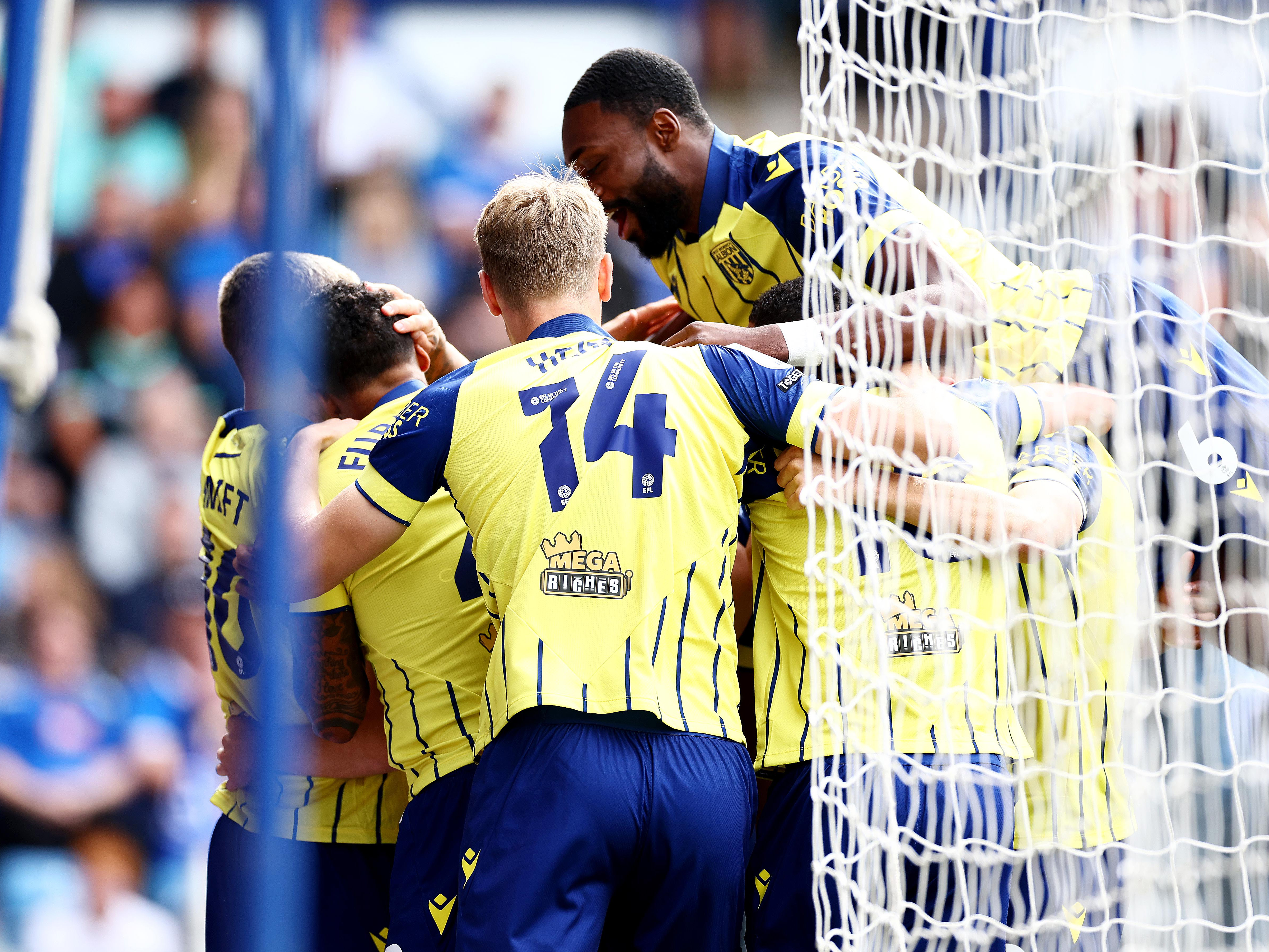 An image of Albion players celebaring Josh Maja's goal against Portsmouth