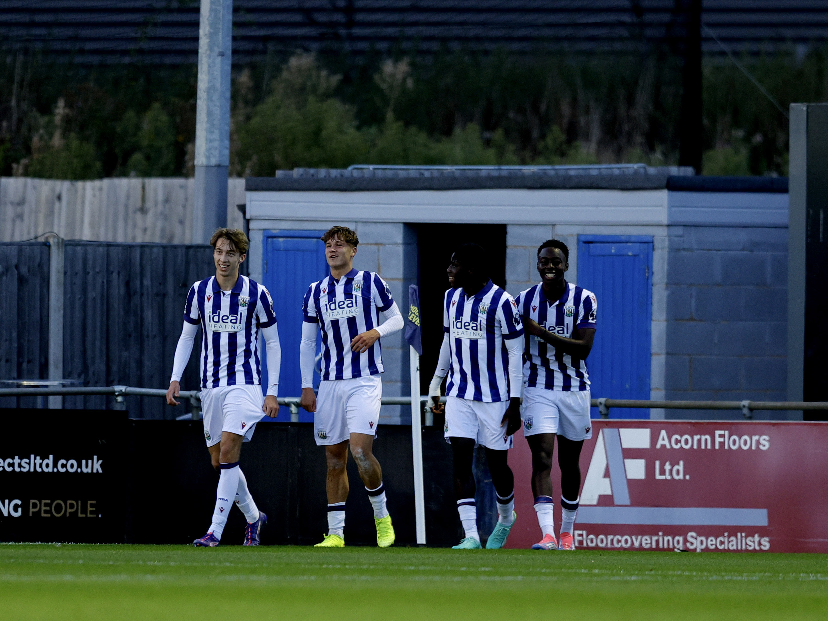 A photo of Albion youngster Cole Deeming celebrating with team-mats in the 2024/25 home kit after scoring in a PL Cup game