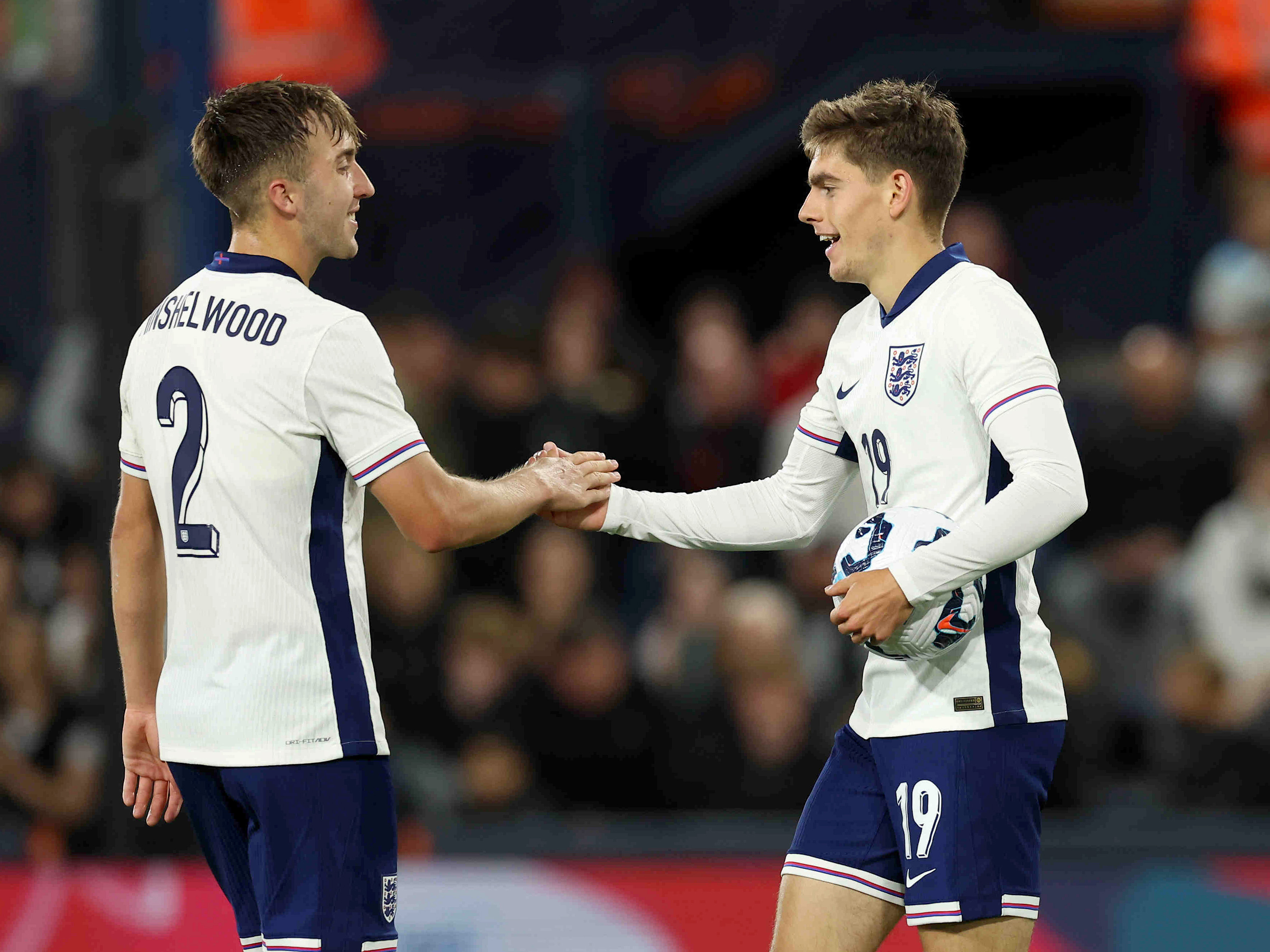 Tom Fellows celebrates scoring a goal for England's U21s with a team-mate