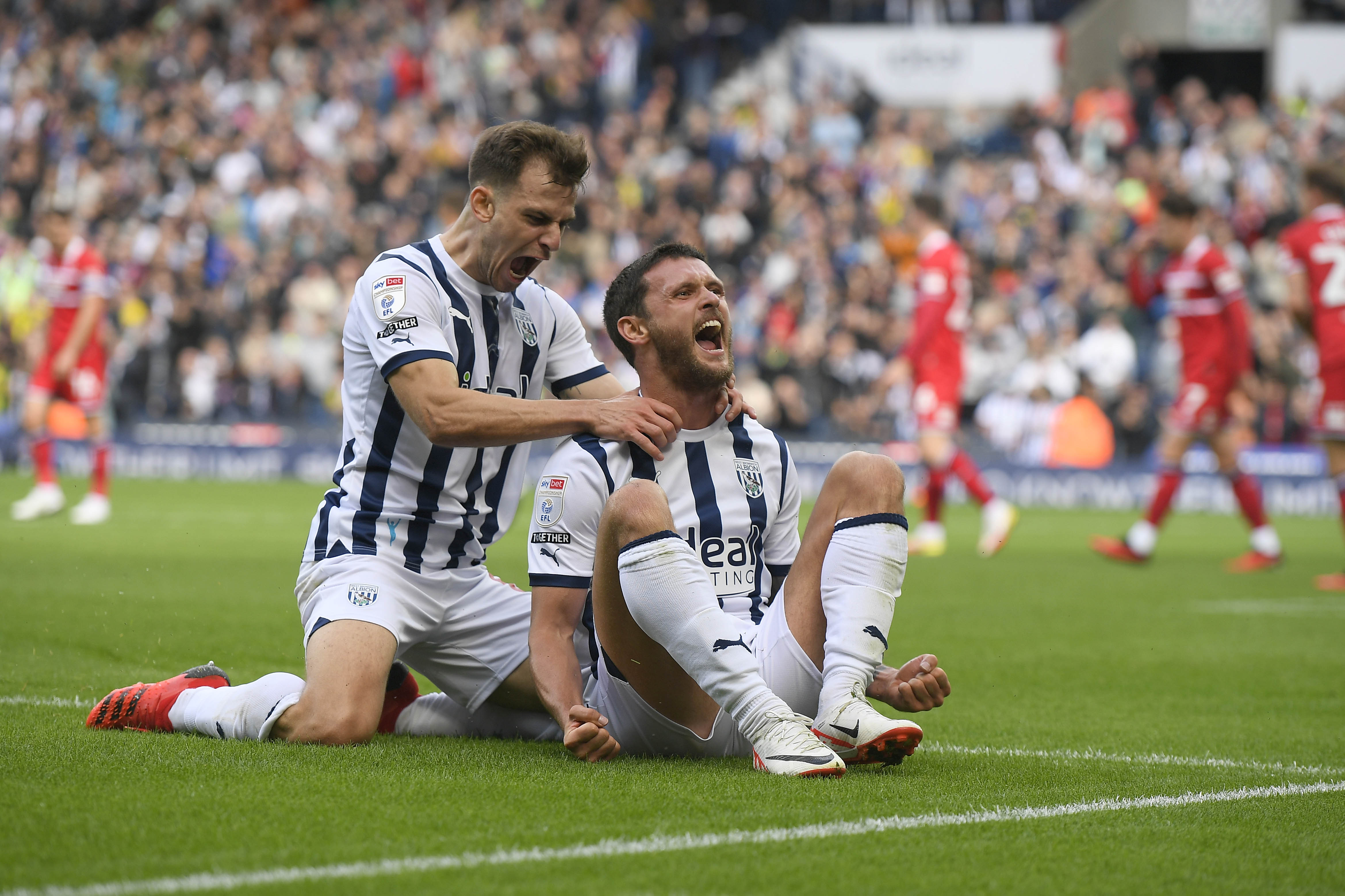 John Swift celebrates with Jayson Molumby after scoring against Middlesbrough at The Hawthorns