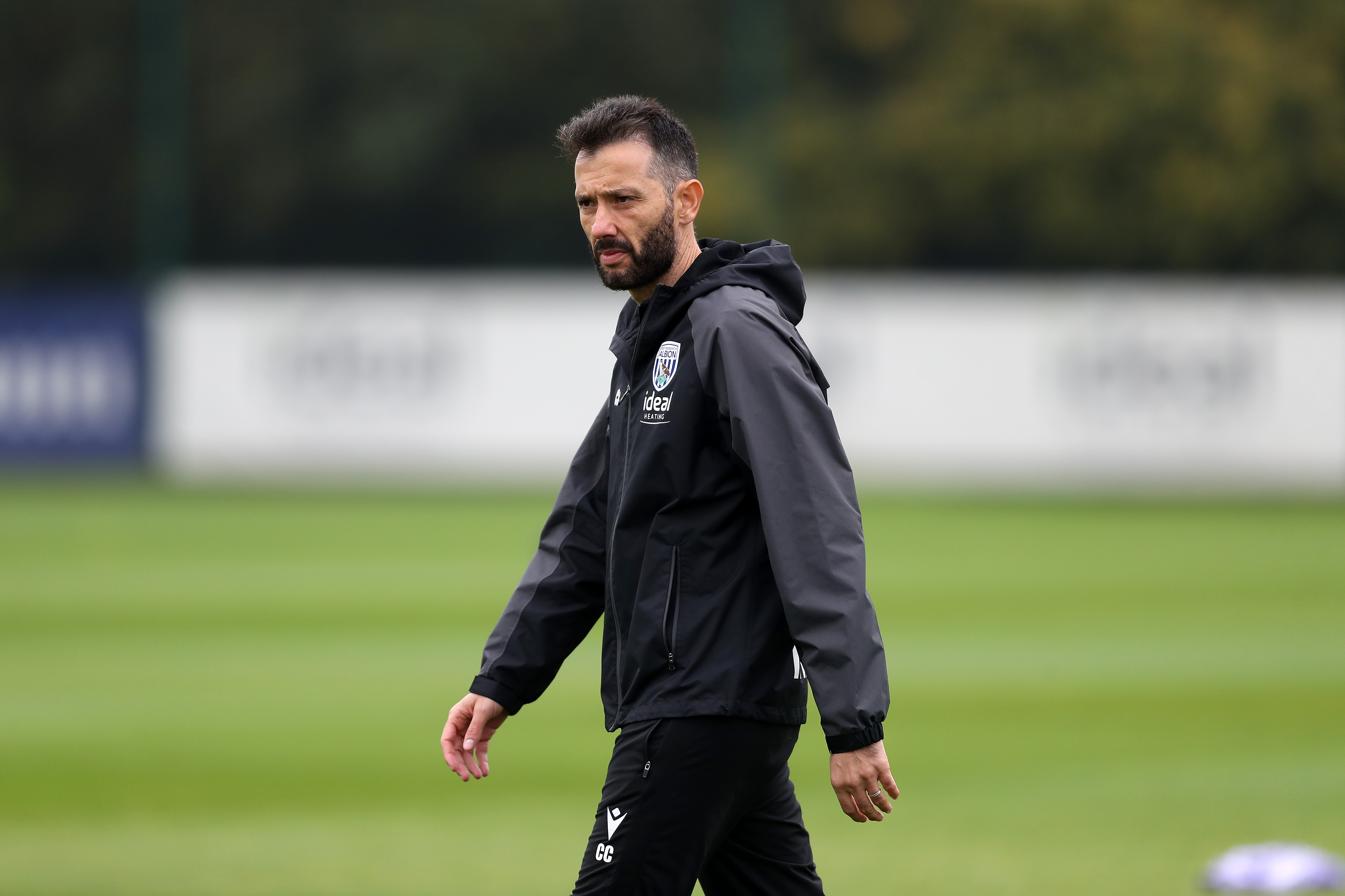 Carlos Corberán watching training 