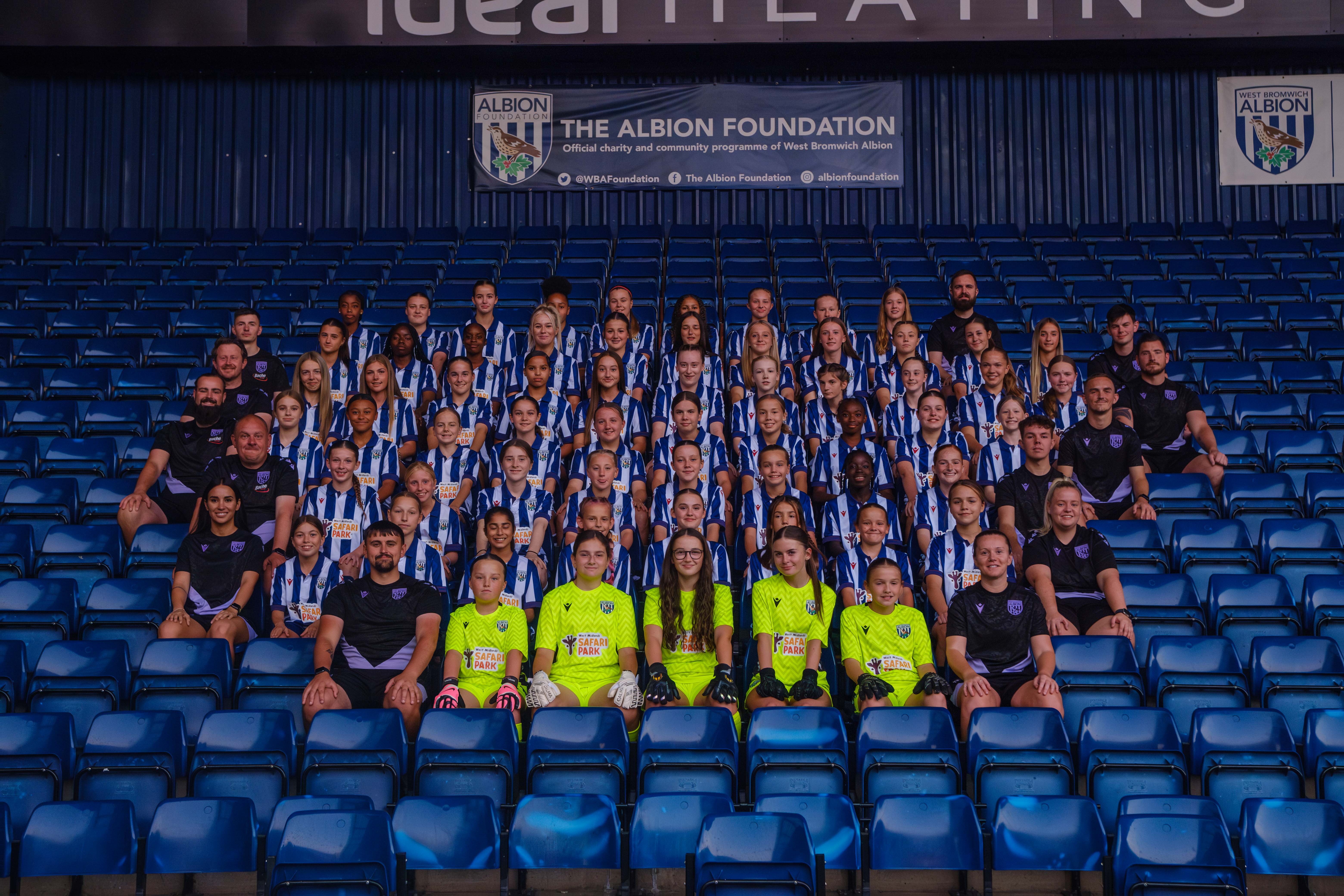 GGP Full squad photo, sitting in the stands.