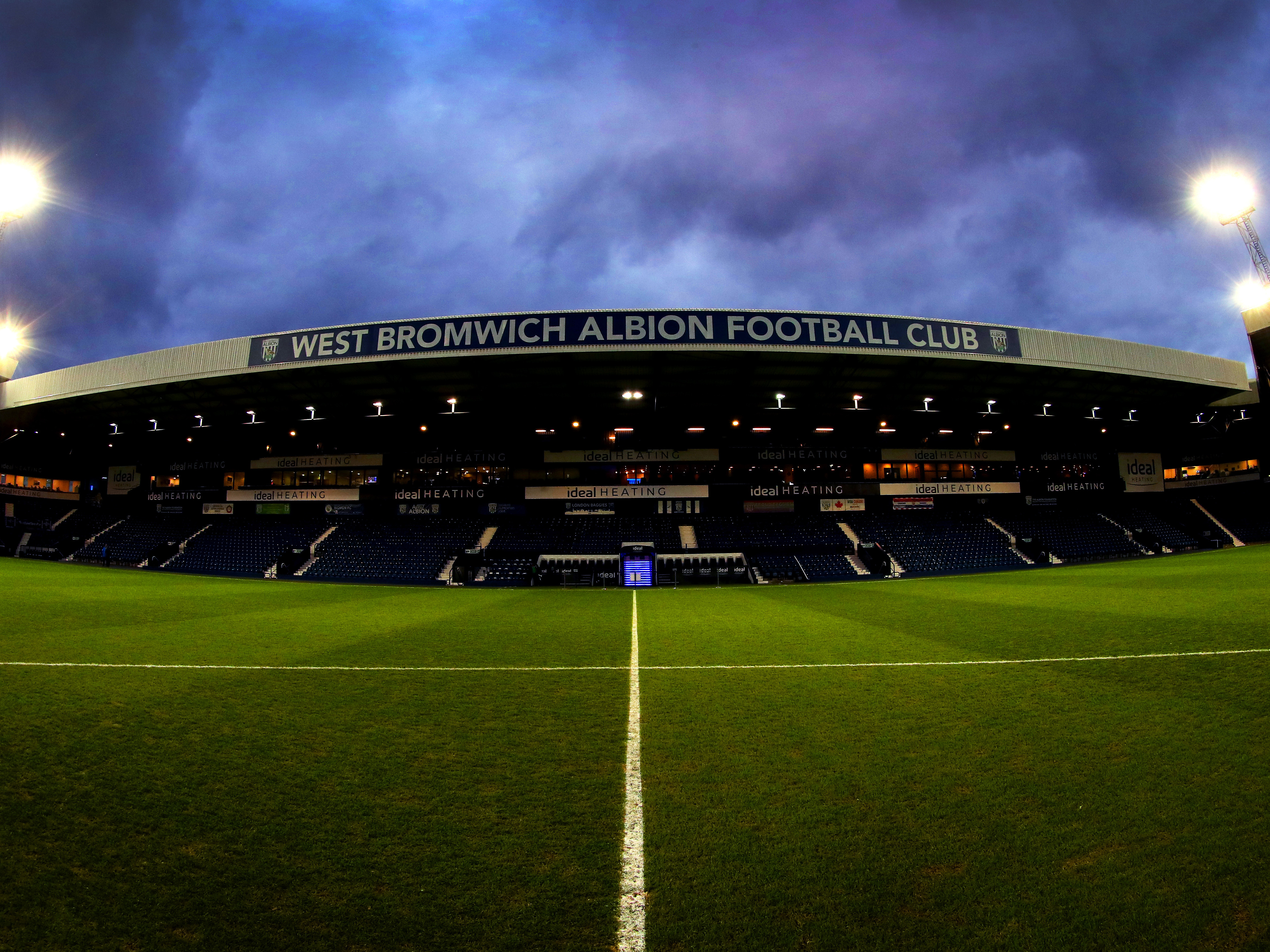 A photo of the Halfords Lane Stand at The Hawthorns under the lights