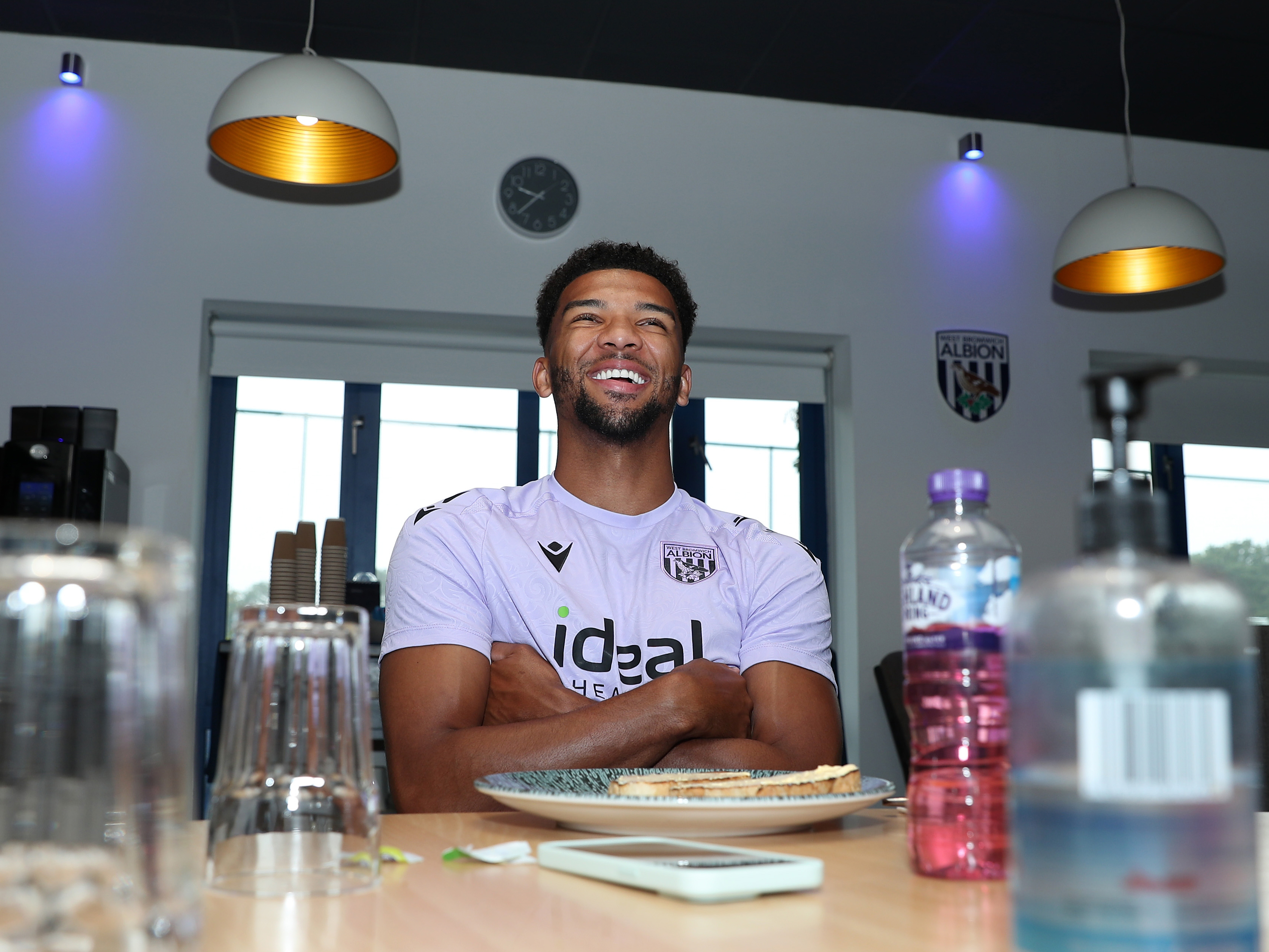 Mason Holgate smiling while sat at a table in the canteen