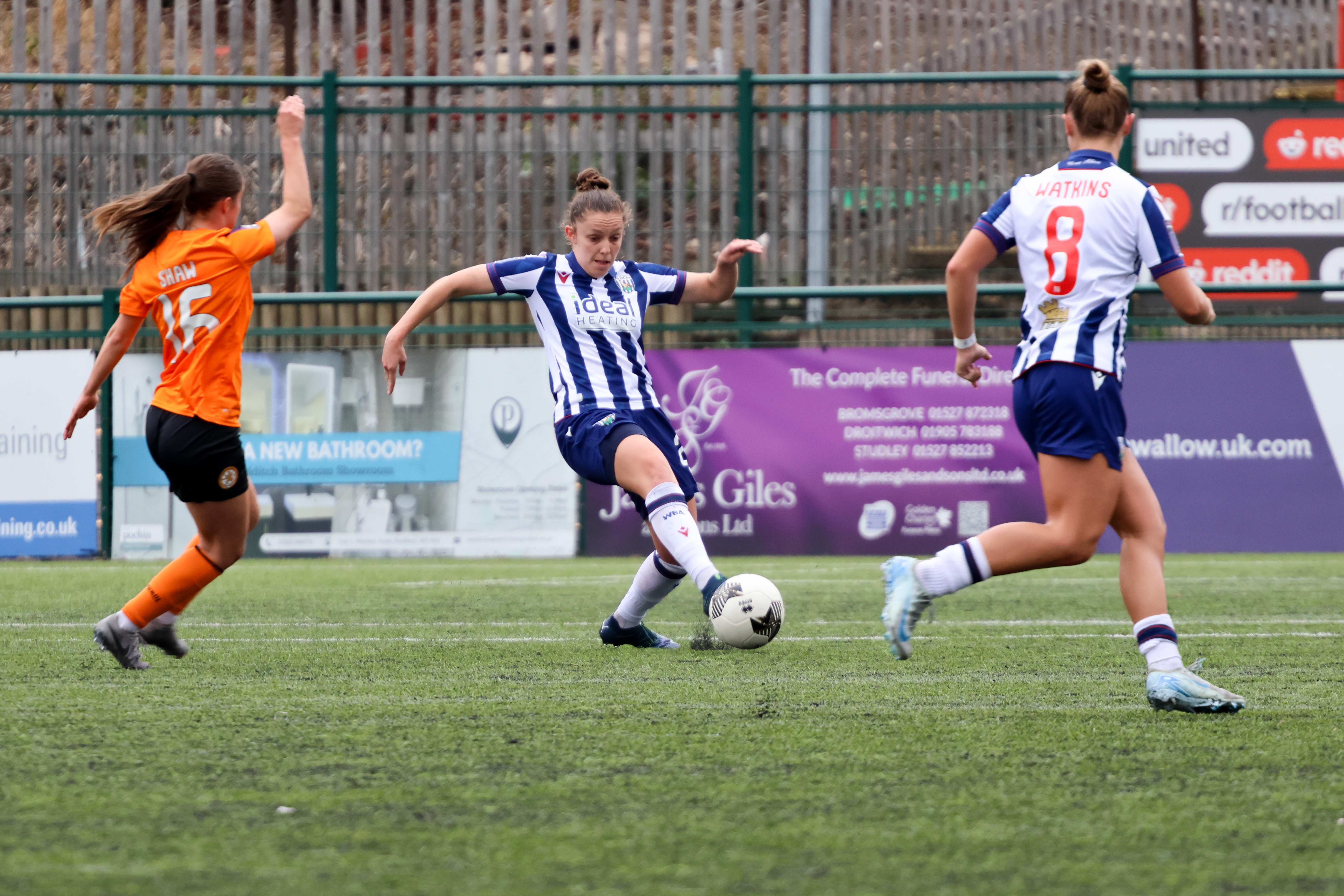 An image of Kate Evans on the ball against Rugby Borough