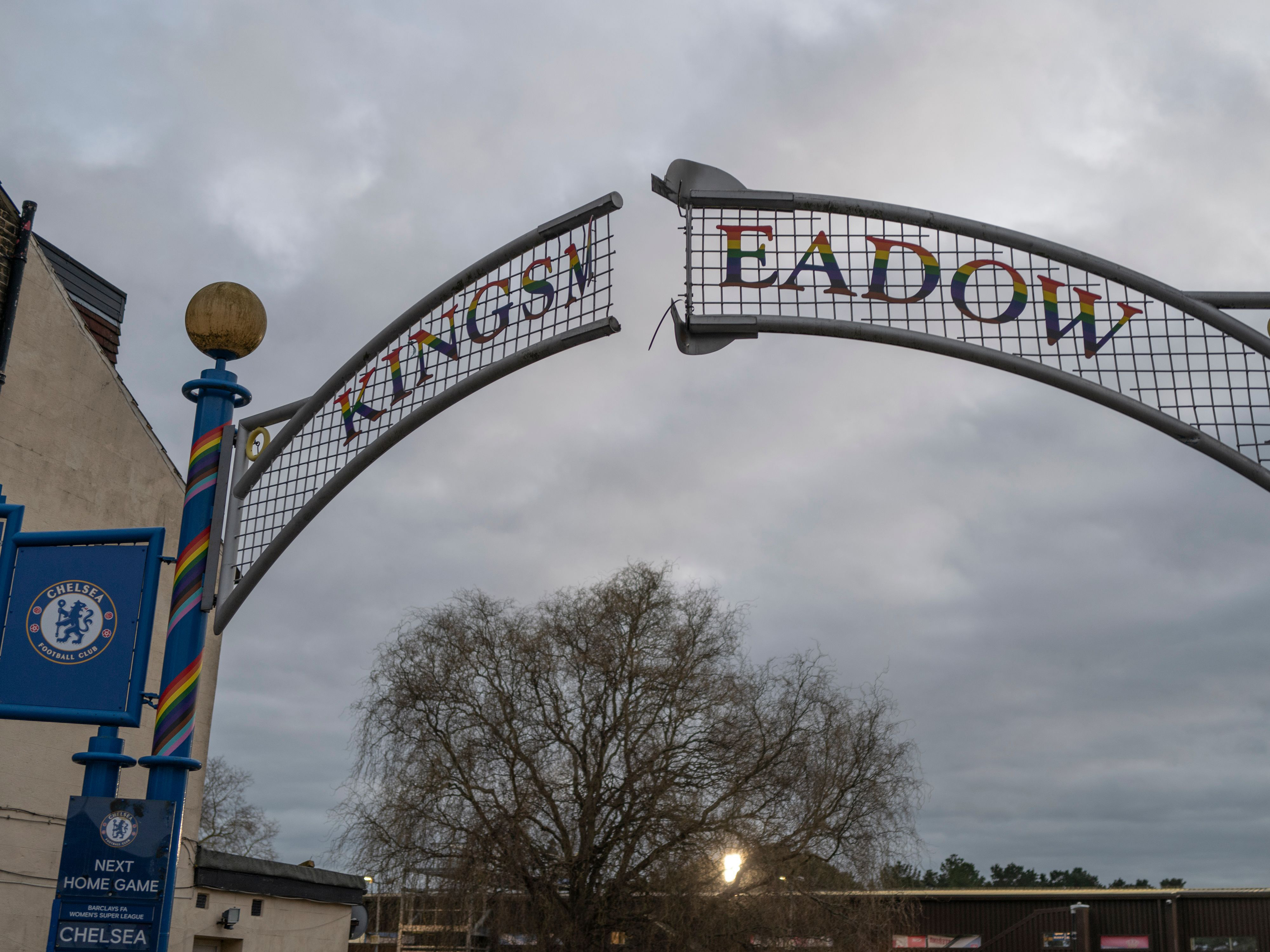 A photo of a sign stating 'Kingsmeadow' above the entrance to Kingsmeadow stadium