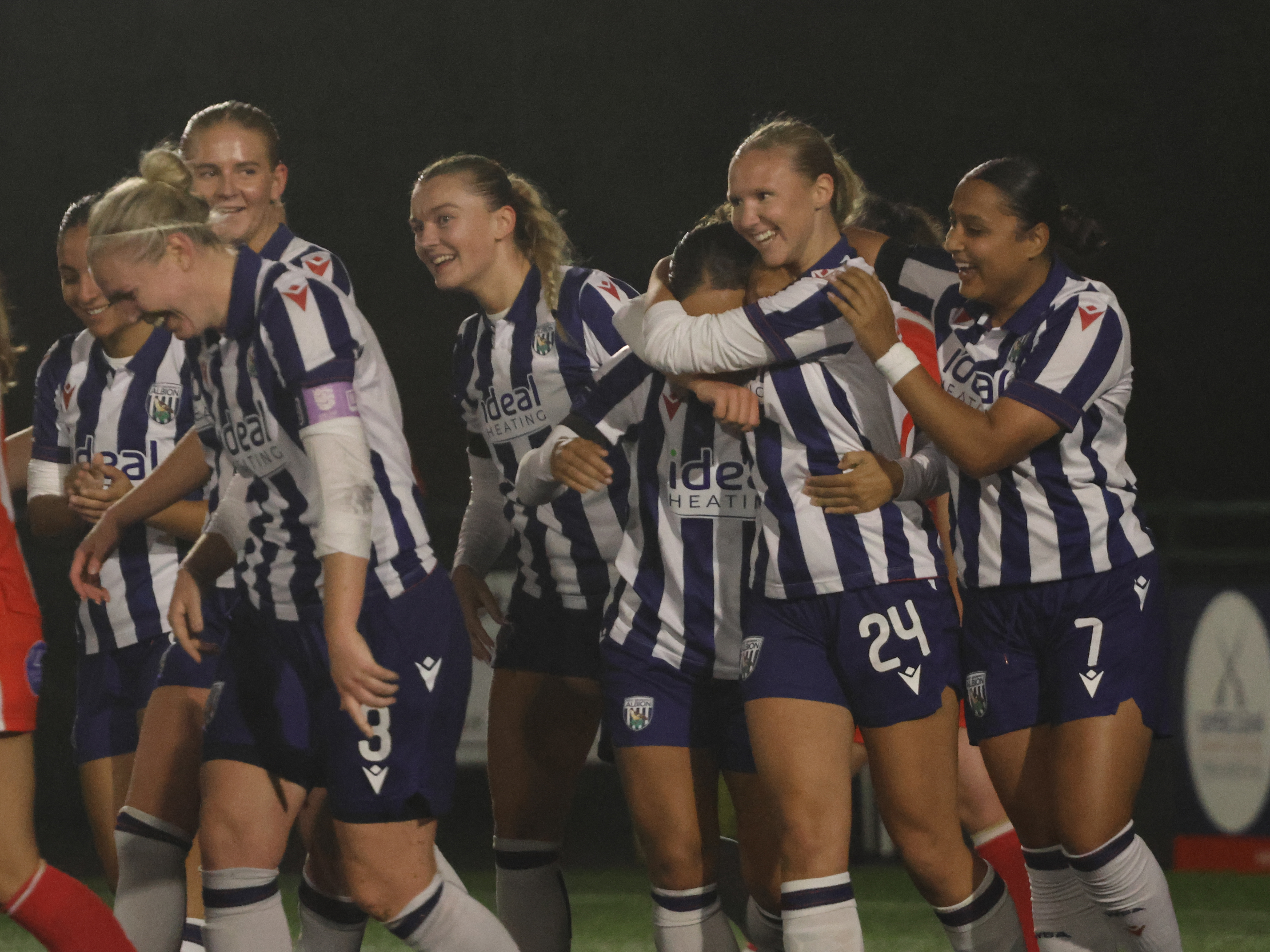 An image of Lucy Davies celebrating with her teammates after her first ever Albion Women goal against Stourbridge