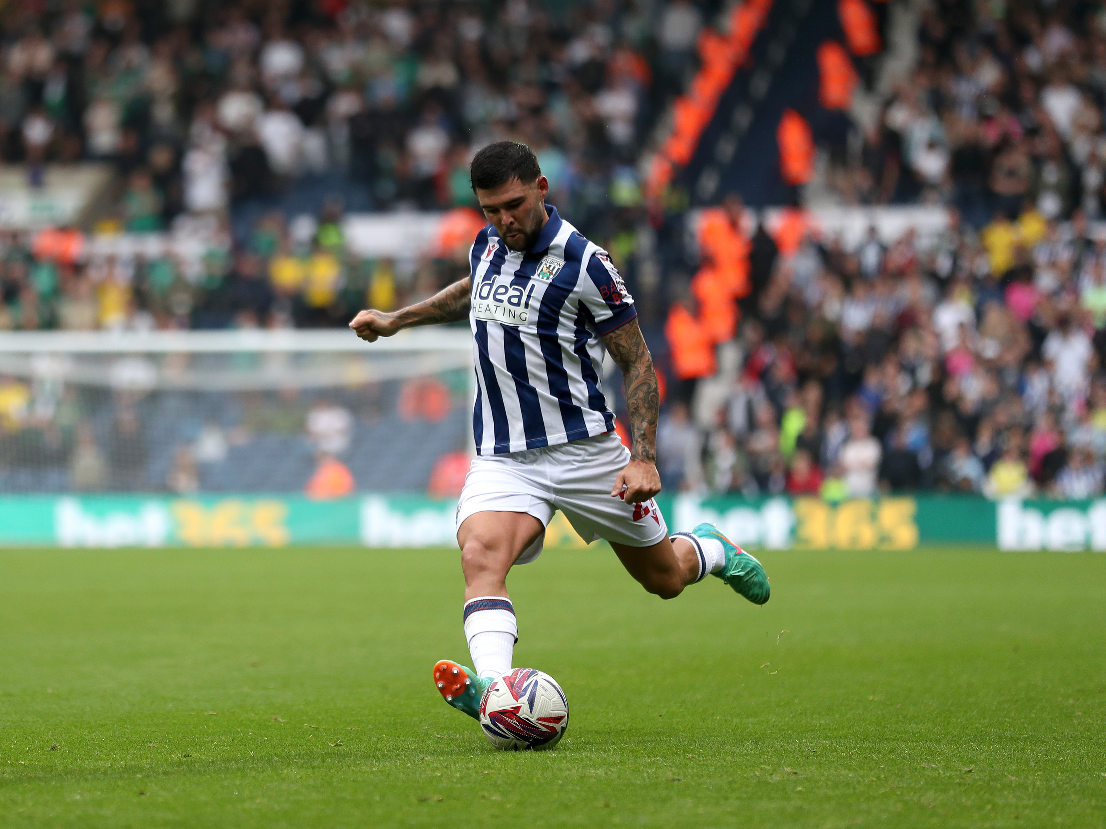 A photo of Alex Mowatt playing at The Hawthorns in the 2024/25 home kit