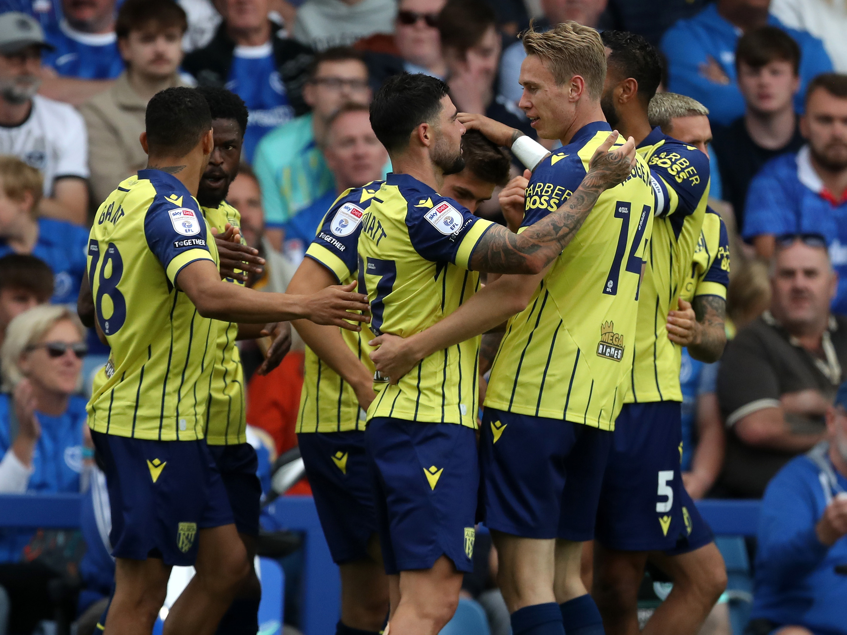 An image of Alex Mowatt celebrating with his teammates after scoring against Portsmouth