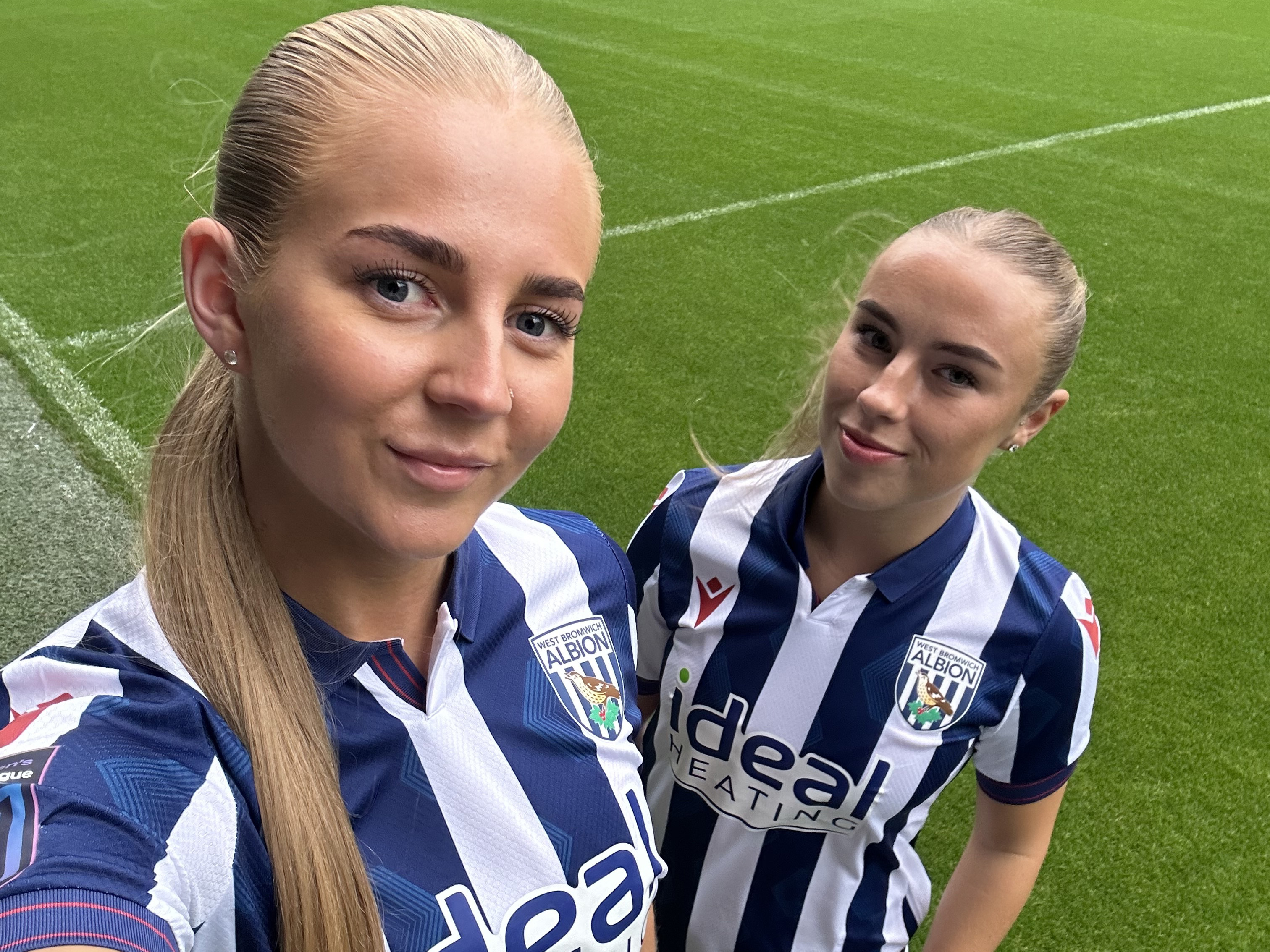 Rhianne Oakley and Seren Watkins take a selfie while wearing the home kit 