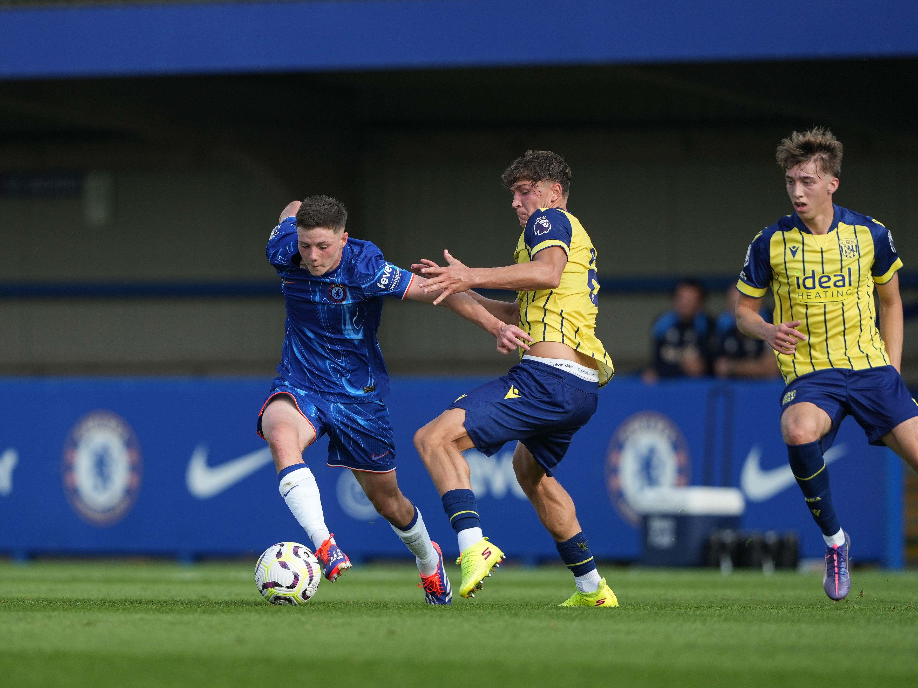 A photo of Cole Deeming and Harry Whitwell, in the 2024.25 away kit, battling for the ball