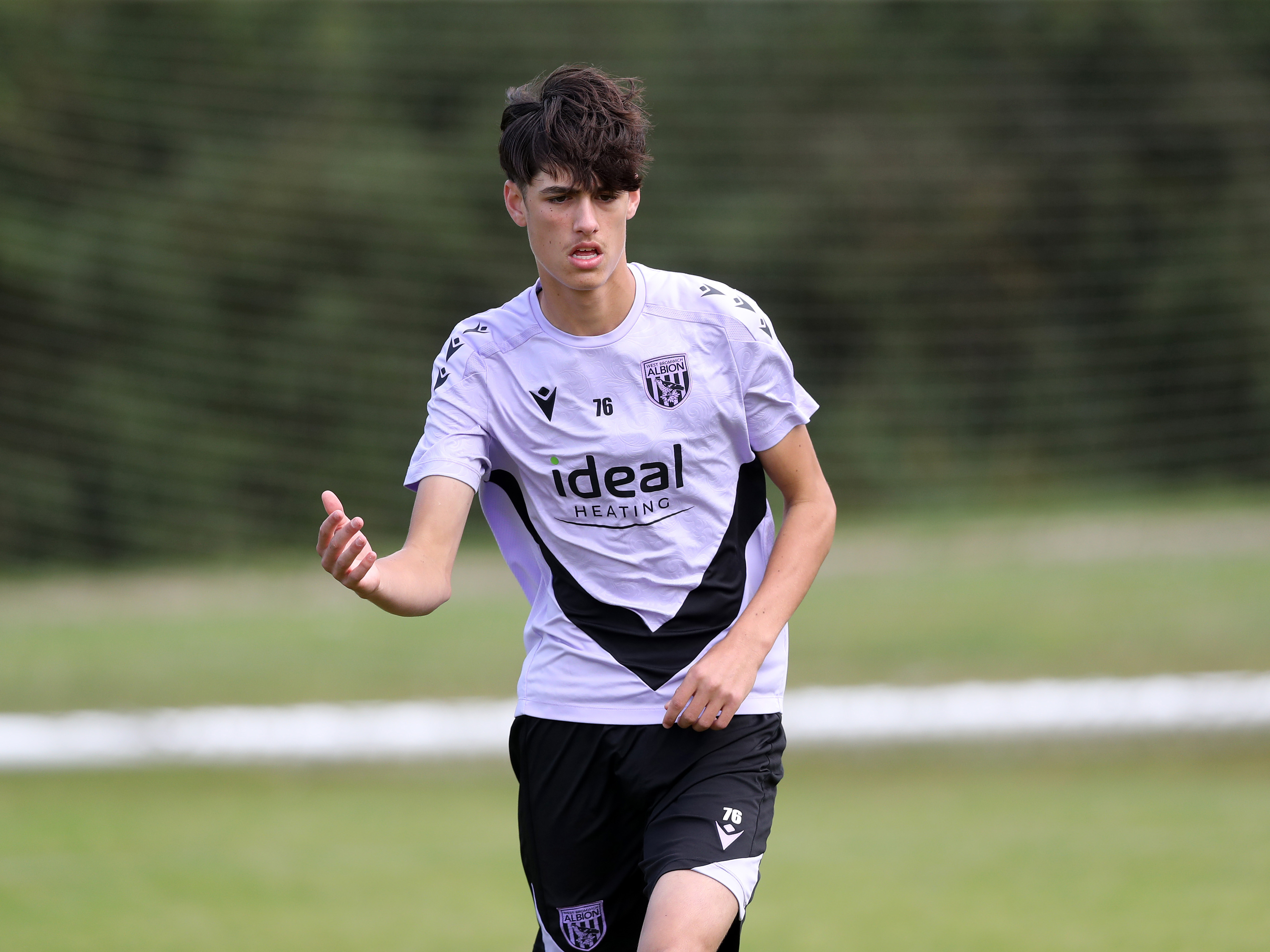 A photo of Albion U18s player Rio Parmar in the 2024/25 purple training kit