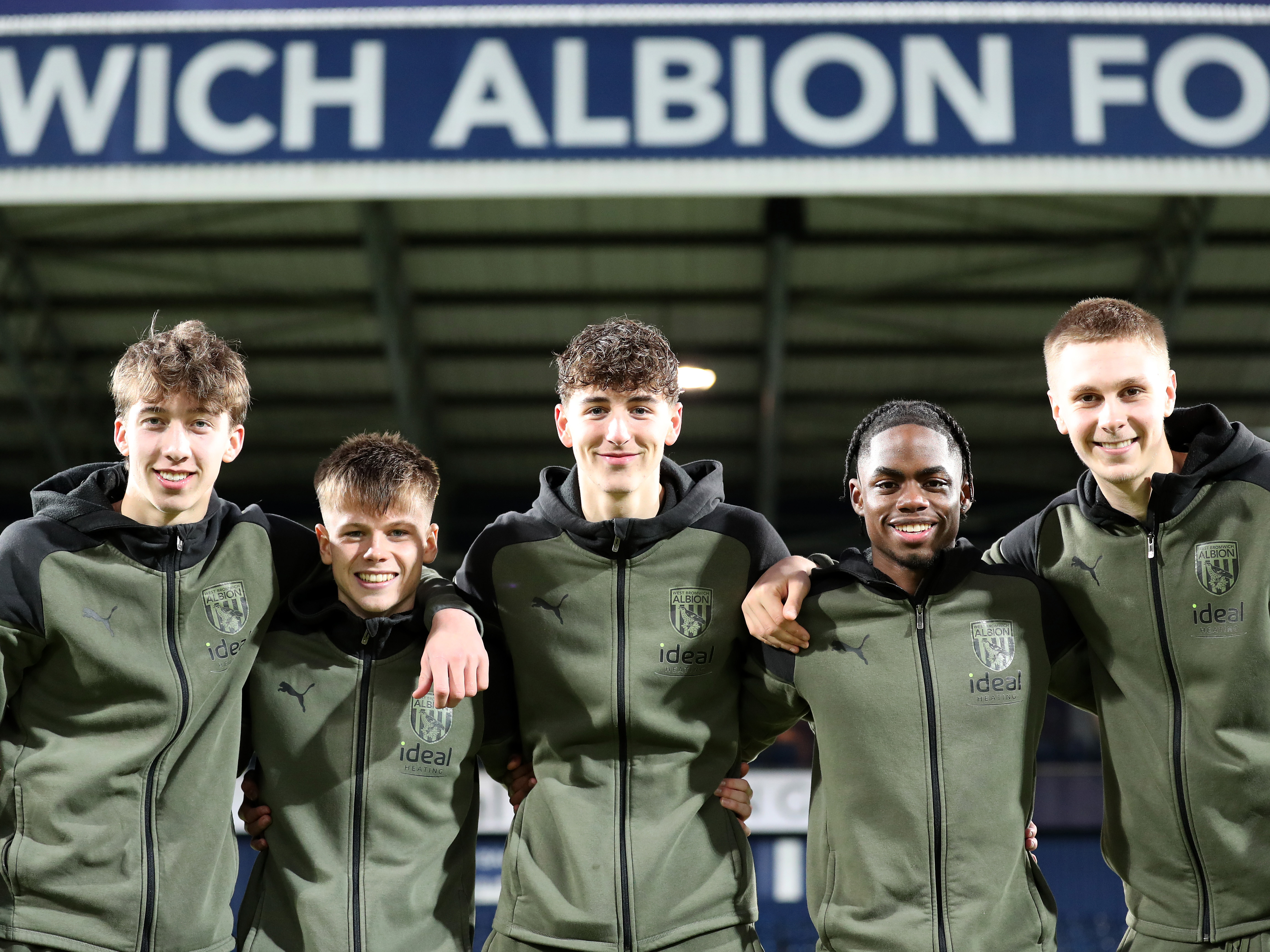 A photo of Albion academy graduates Harry Whitwell, Fenton Heard, Josh Shaw, Akeel Higgins and Layton Love together on The Hawthorns pitch