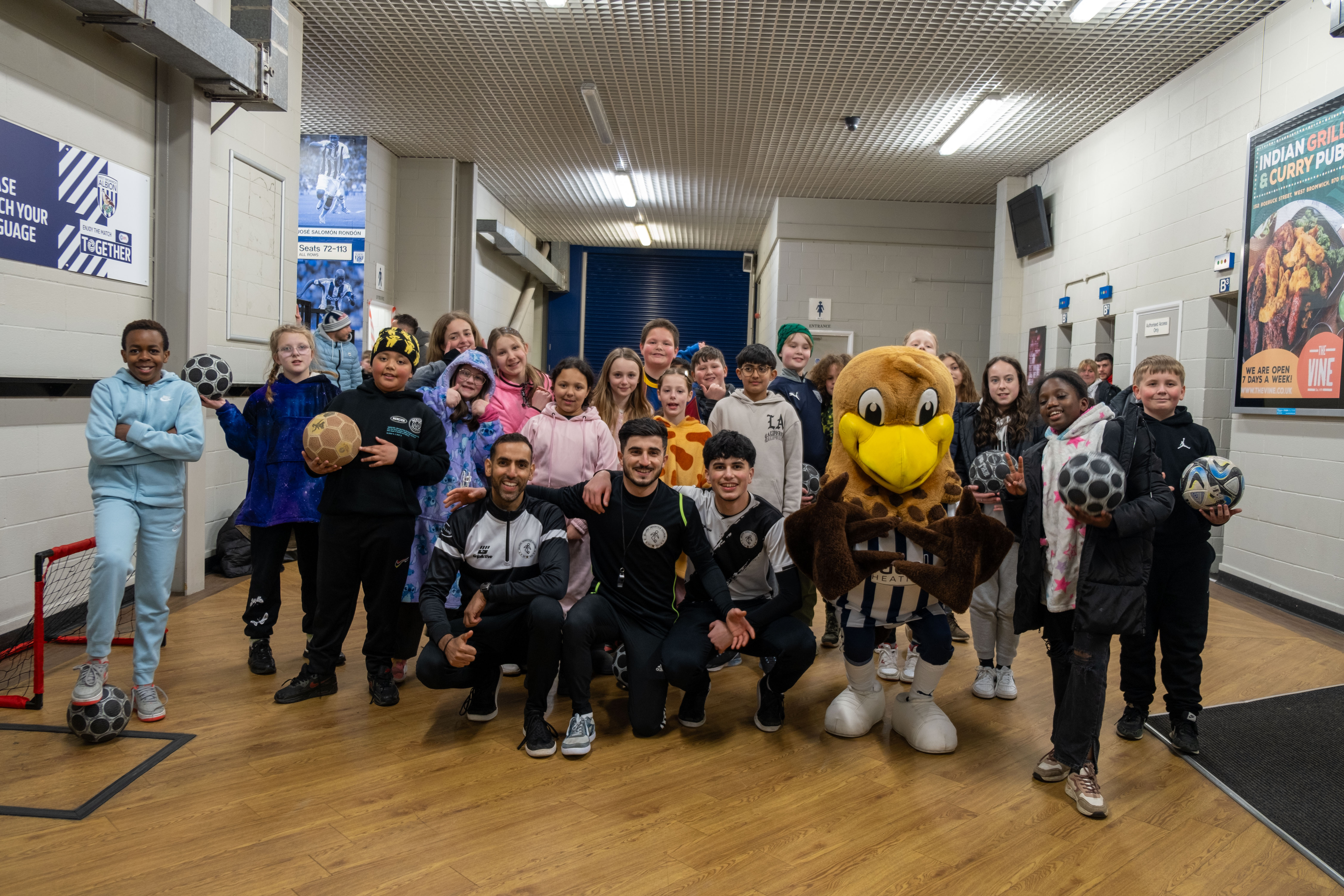 Children from local school in the concourse with Football Freestyle team. 