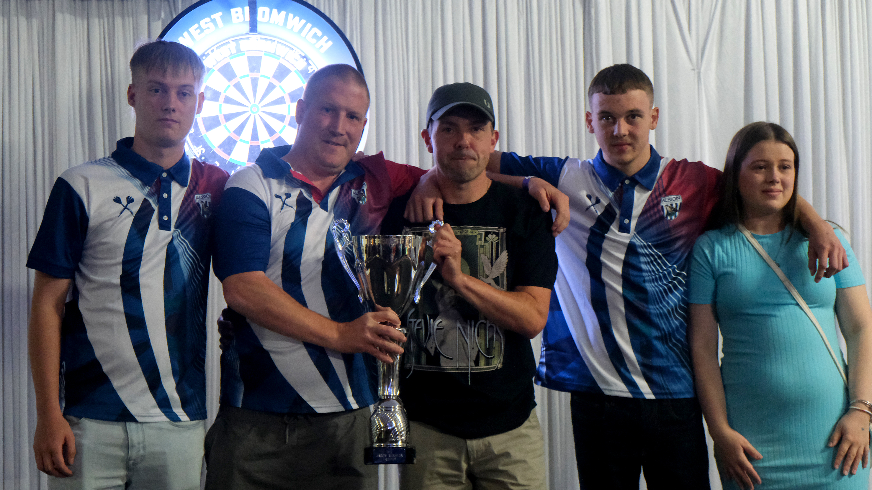 Richard Swallows and his family holding the Squalla Cup.