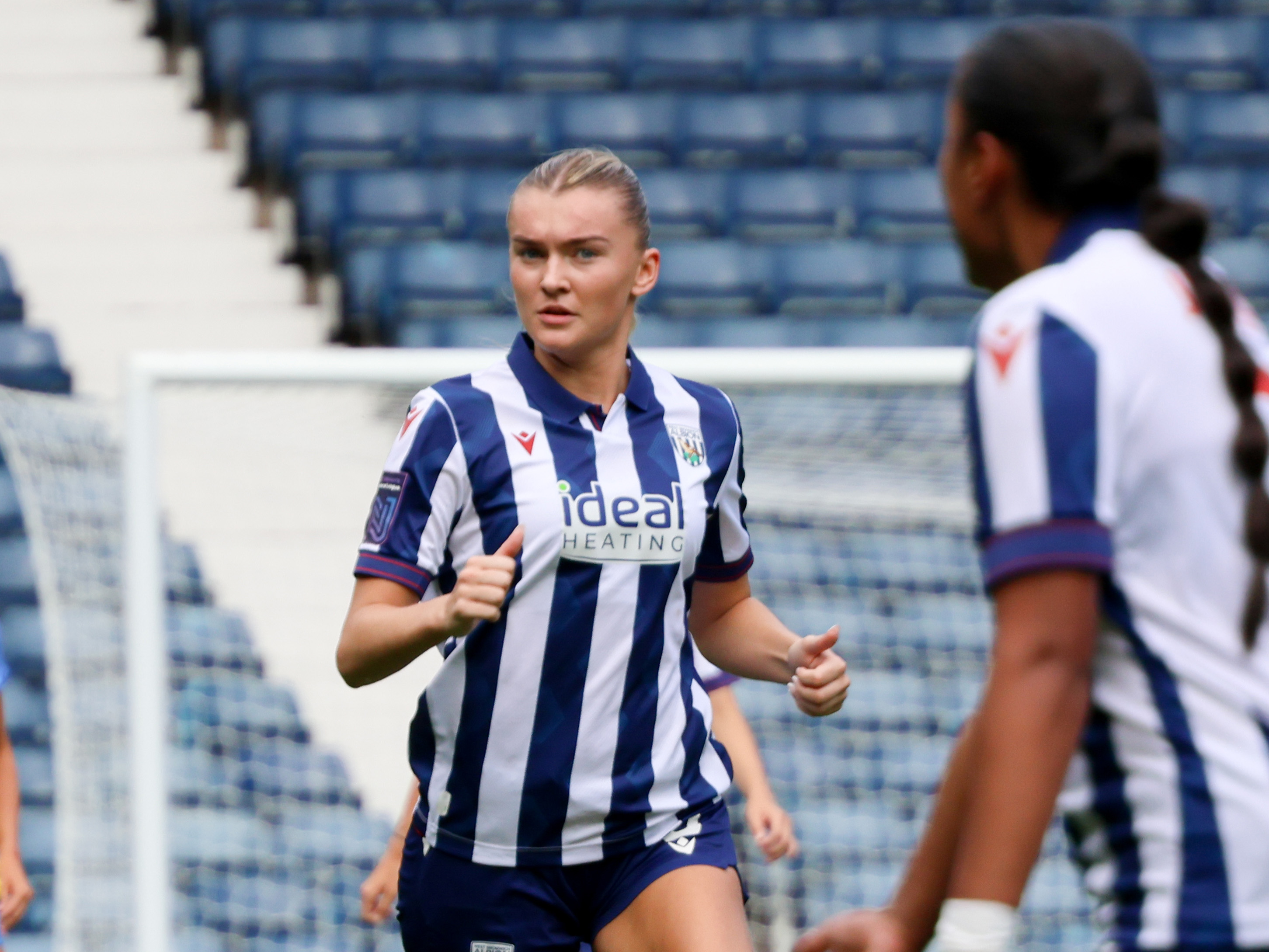 Taylor Reynolds in action for Albion Women wearing the home kit