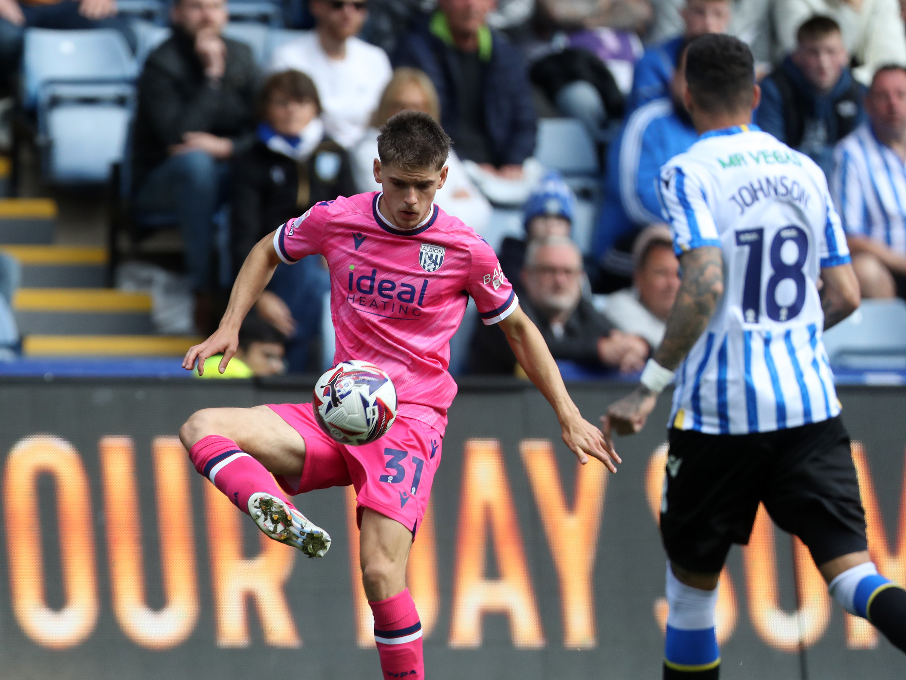 An image of Tom Fellows controlling the ball