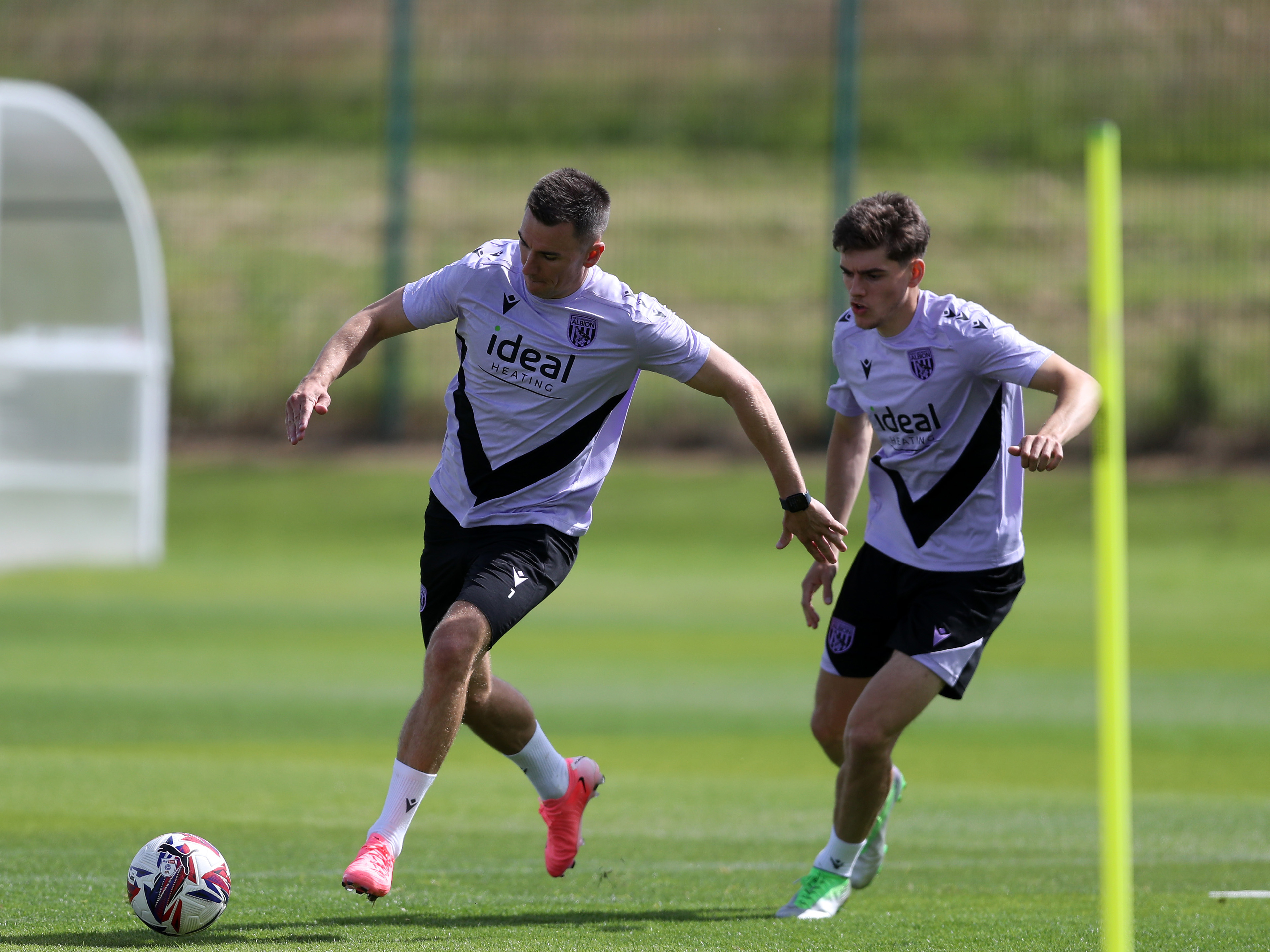 Jed Wallace and Tom Fellows chasing the ball during a training session