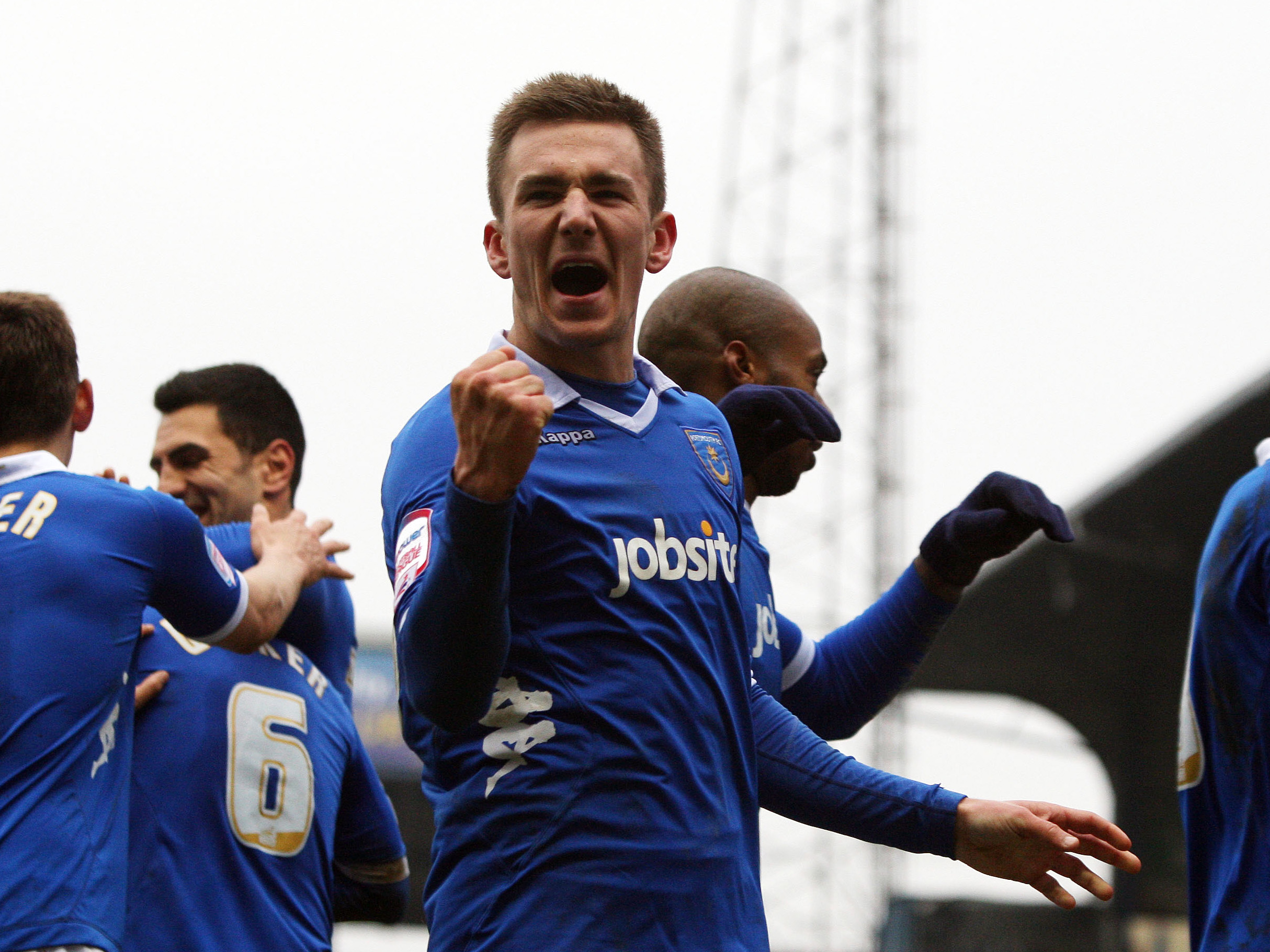 Jed Wallace celebrates scoring a goal for Portsmouth in 2012